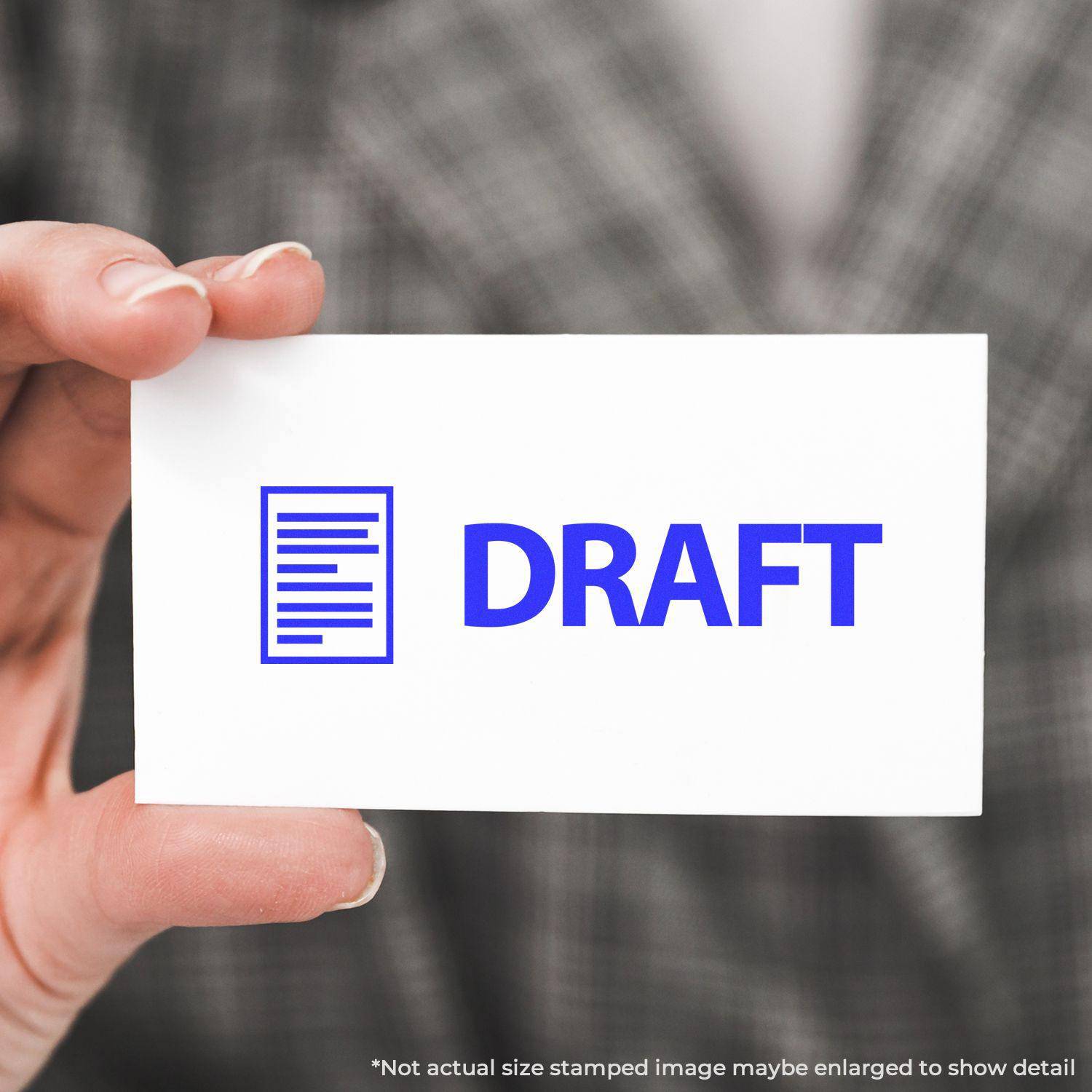 Person holding a card stamped with DRAFT using the Large Pre-Inked Draft with Letter Stamp, showing a blue draft icon and text.