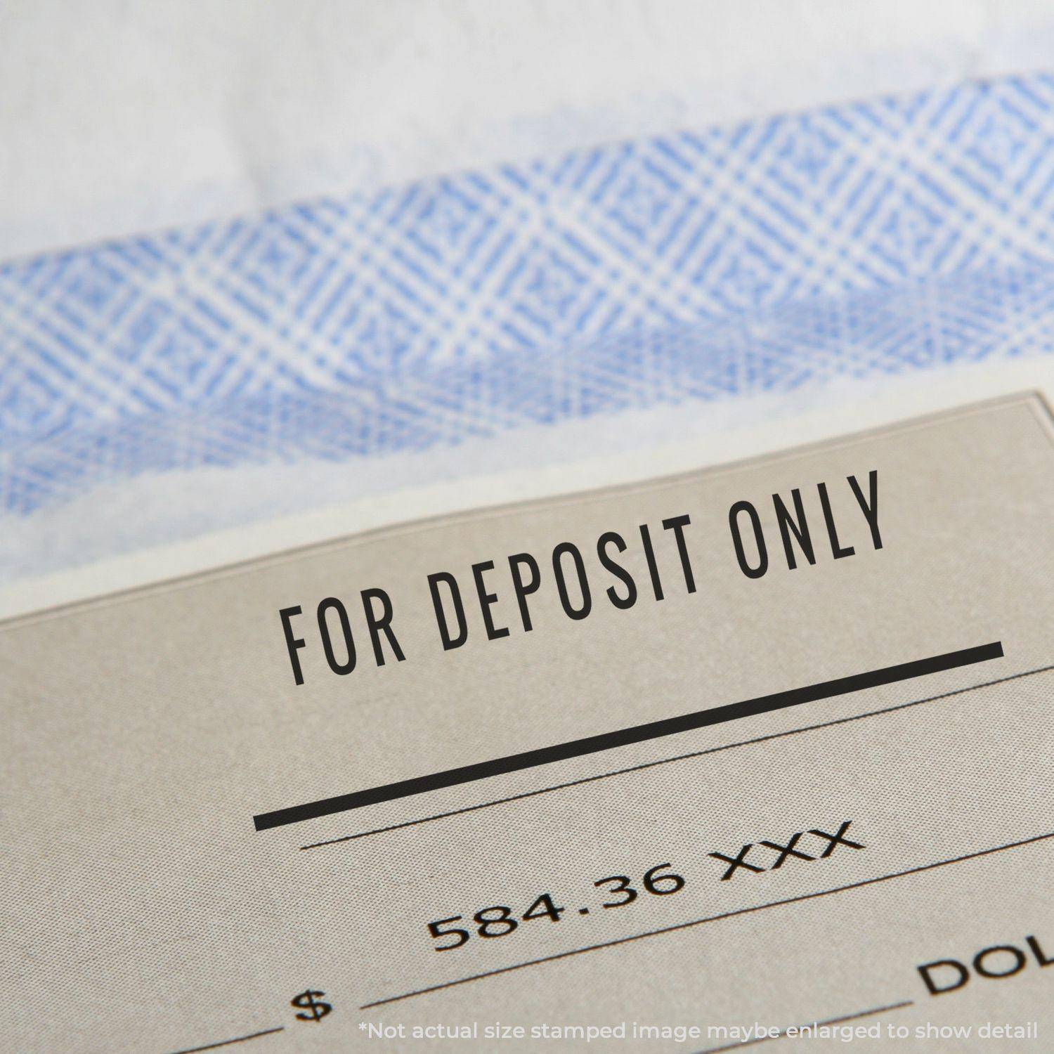 Close-up of a check stamped with 'For Deposit Only' using the Large Pre-Inked For Deposit Only with Line Stamp.