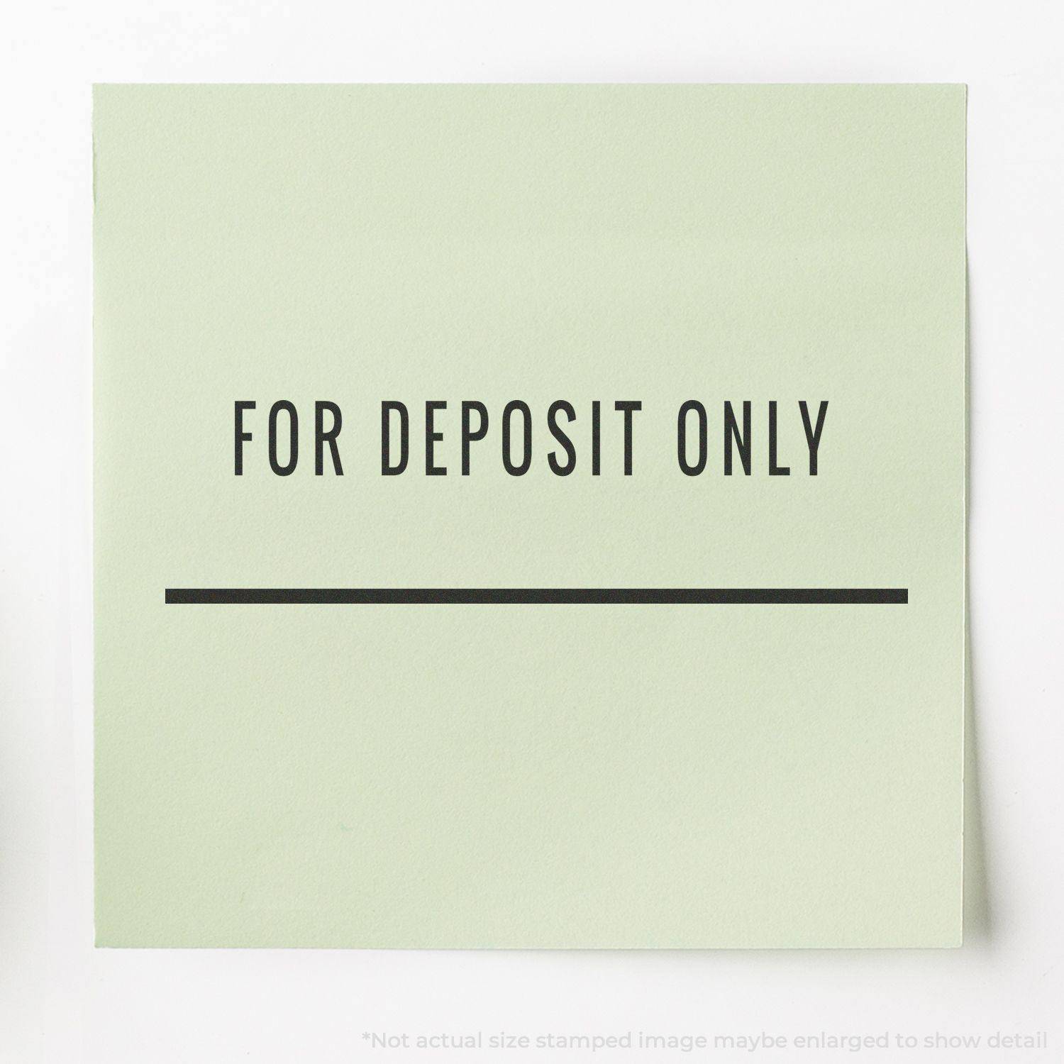 Large Pre-Inked For Deposit Only with Line Stamp used on a green paper, showing clear and bold text with a line underneath.