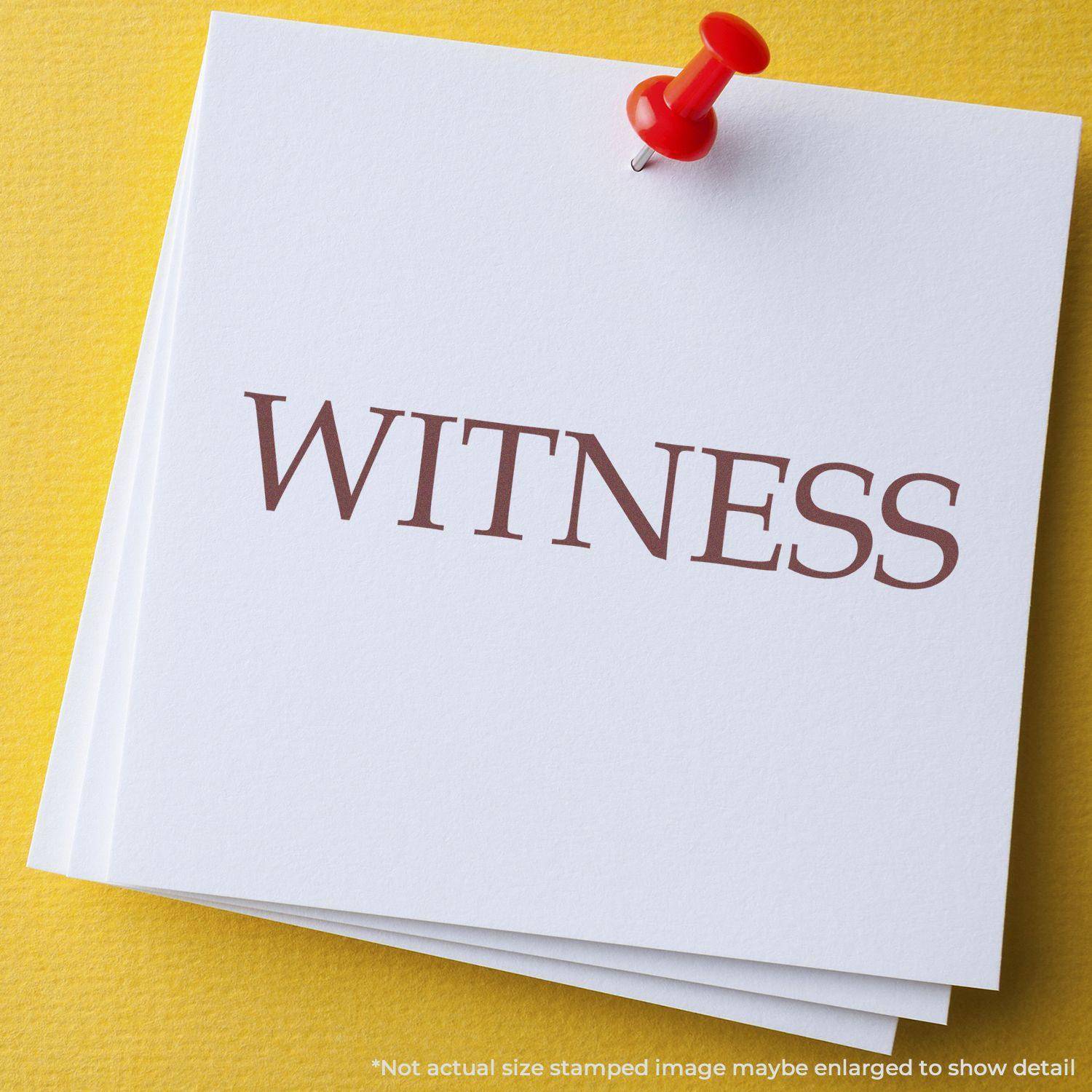 A stack of white papers with the word WITNESS stamped in brown ink using the Large Pre-Inked Witness Stamp, pinned with a red pushpin.