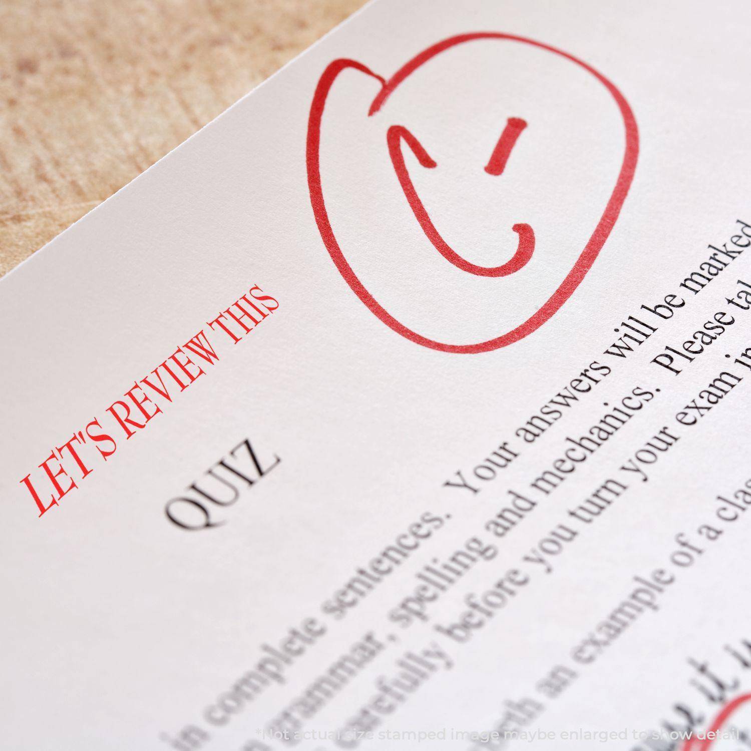 Large Pre-Inked Let's Review This Stamp in red ink on a quiz paper, featuring a smiley face and the text LET'S REVIEW THIS in bold red letters.