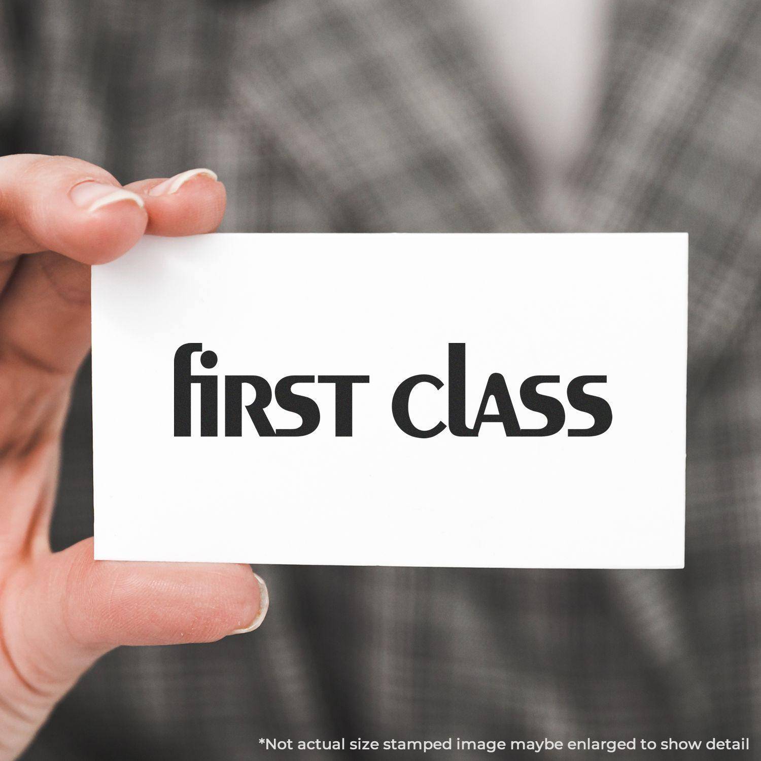 Person holding a card stamped with first class using the Large Pre-Inked Lower Case First Class Stamp.