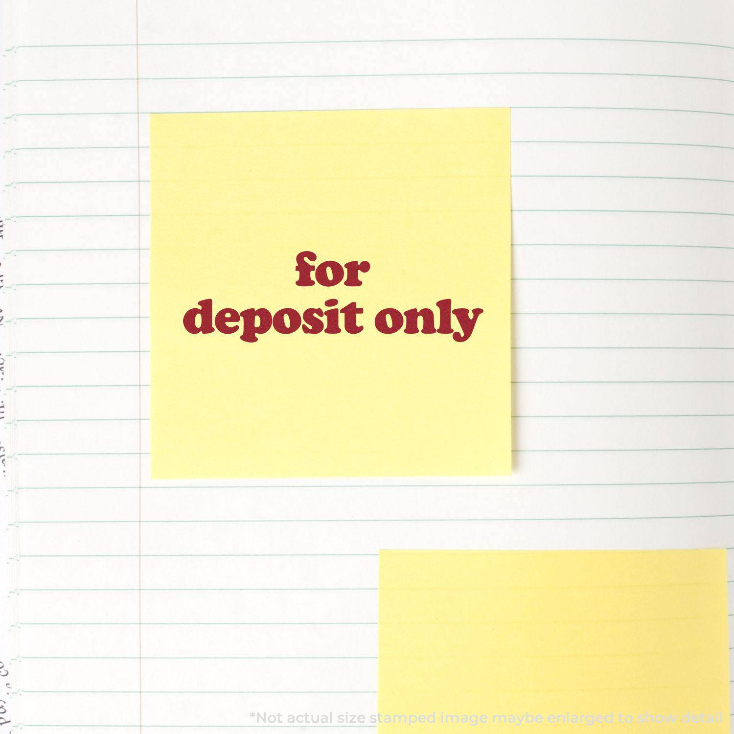 Large Pre-Inked Lowercase For Deposit Only Stamp used on a yellow sticky note placed on a lined notebook page.