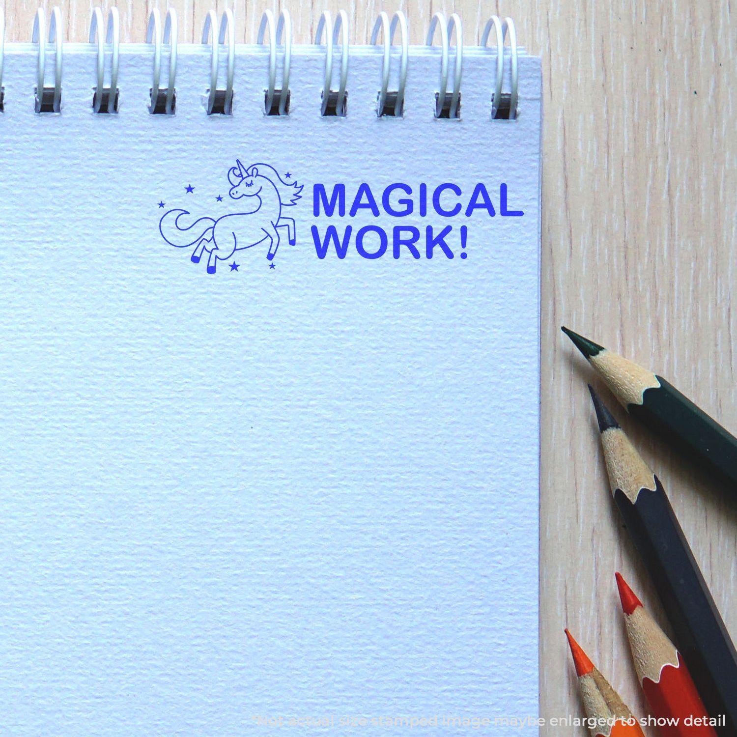 A stock office rubber stamp with a stamped image showing how the text "MAGICAL WORK!" with an image of a unicorn dancing among the stars is displayed after stamping.