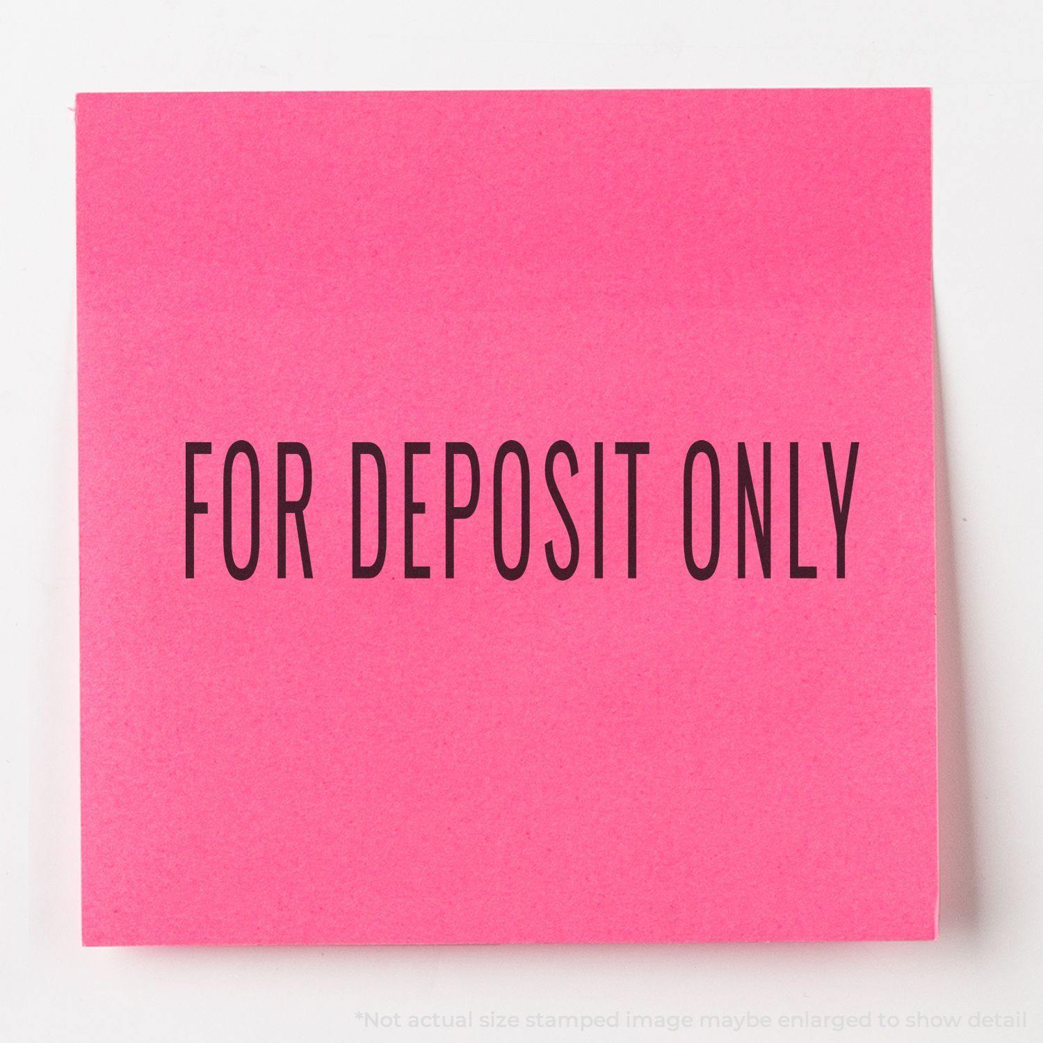 Narrow For Deposit Only rubber stamp impression on a bright pink sticky note, displaying the text FOR DEPOSIT ONLY in bold black letters.