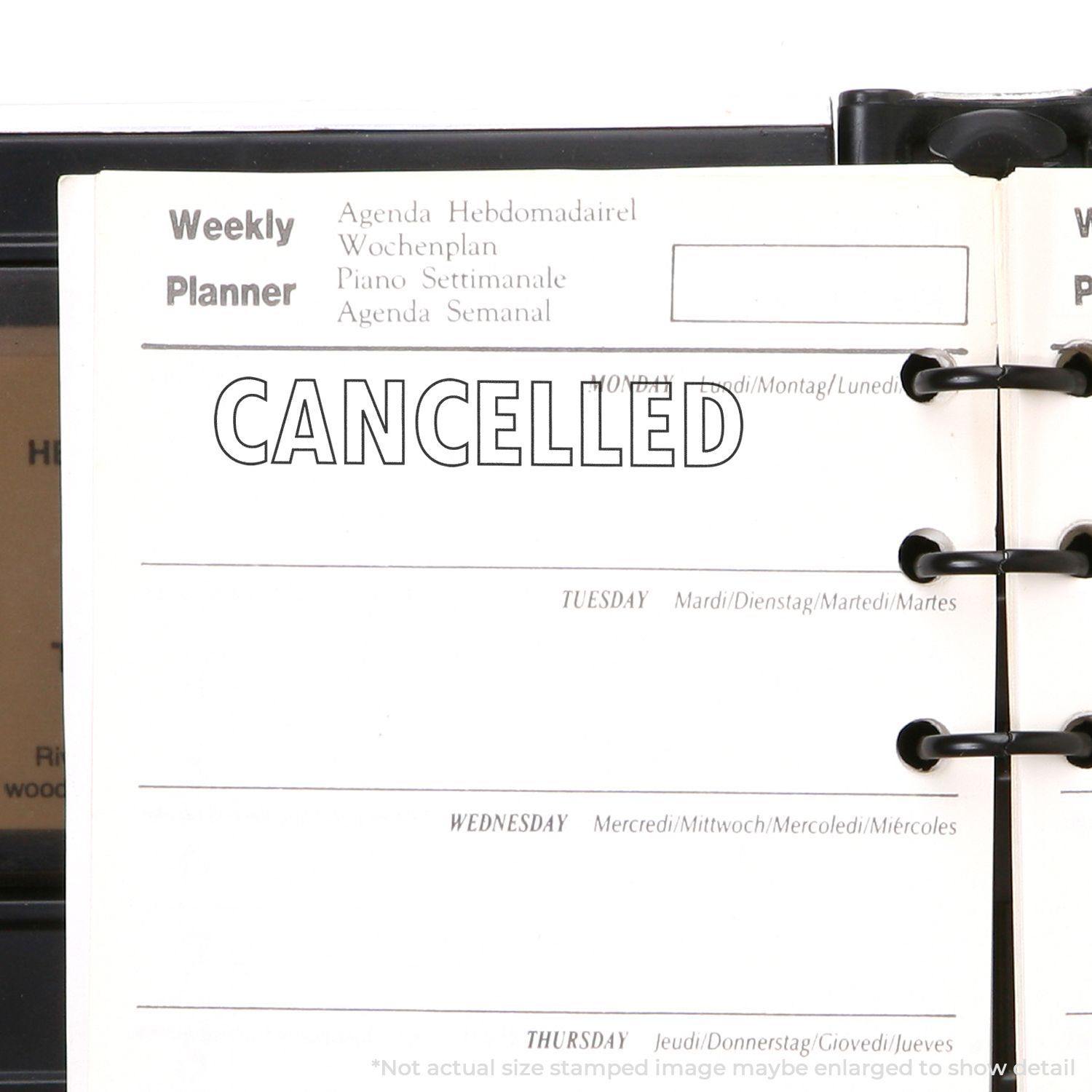A stock office rubber stamp with a stamped image showing how the text "CANCELLED" in an outline font is displayed after stamping.