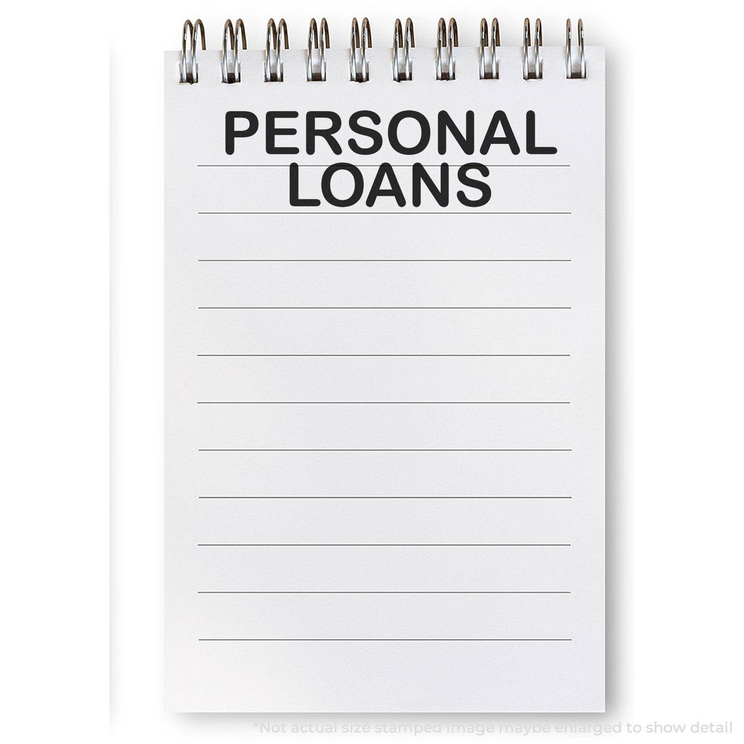 A notepad with PERSONAL LOANS stamped on it using the Large Personal Loans Rubber Stamp. The notepad has lined pages and a spiral binding.