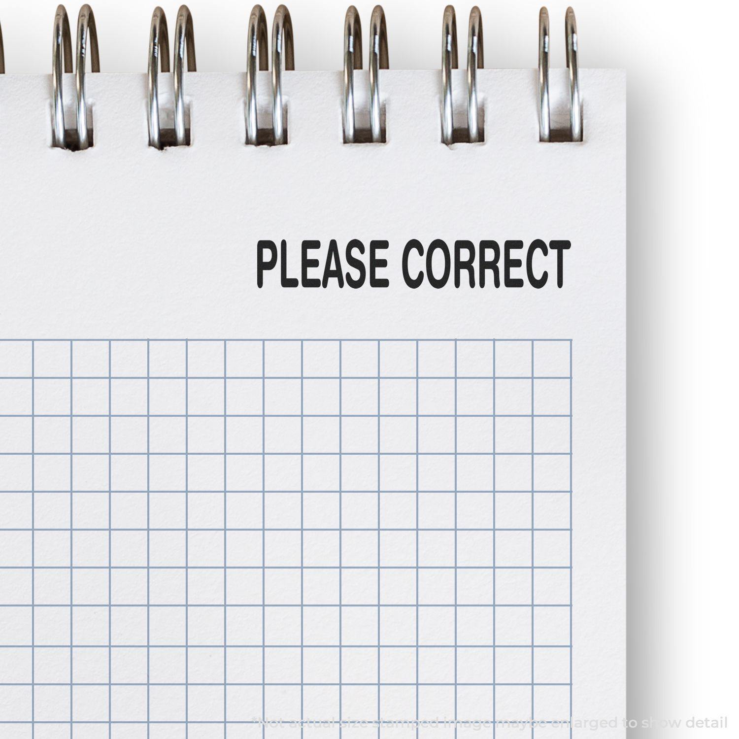 Notebook with grid paper and a 'Please Correct' rubber stamp mark at the top, emphasizing the need for corrections.