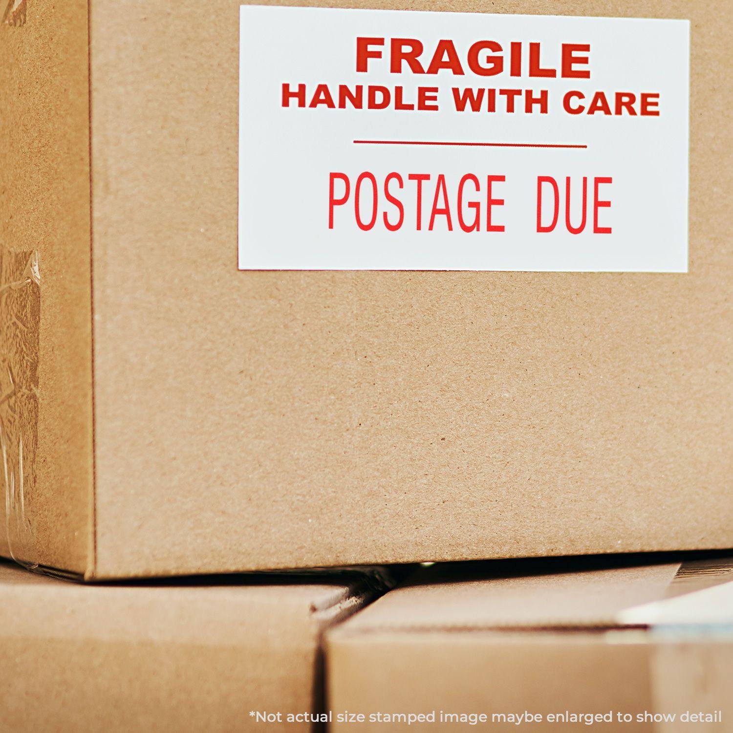 Cardboard boxes with a FRAGILE HANDLE WITH CARE POSTAGE DUE label stamped using a Large Self Inking Postage Due Stamp.