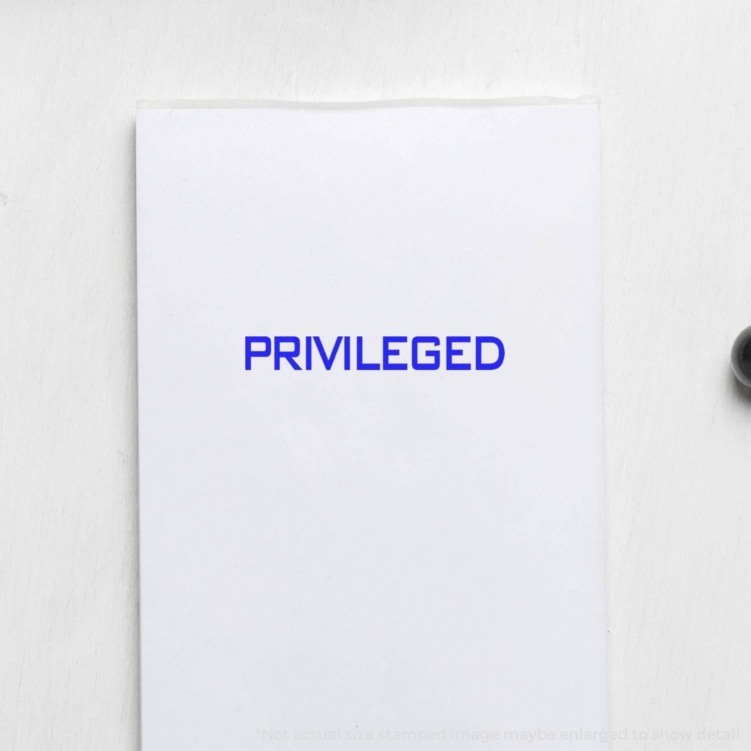 Large Privileged Rubber Stamp in blue ink on white paper, showing the word PRIVILEGED clearly stamped in the center.