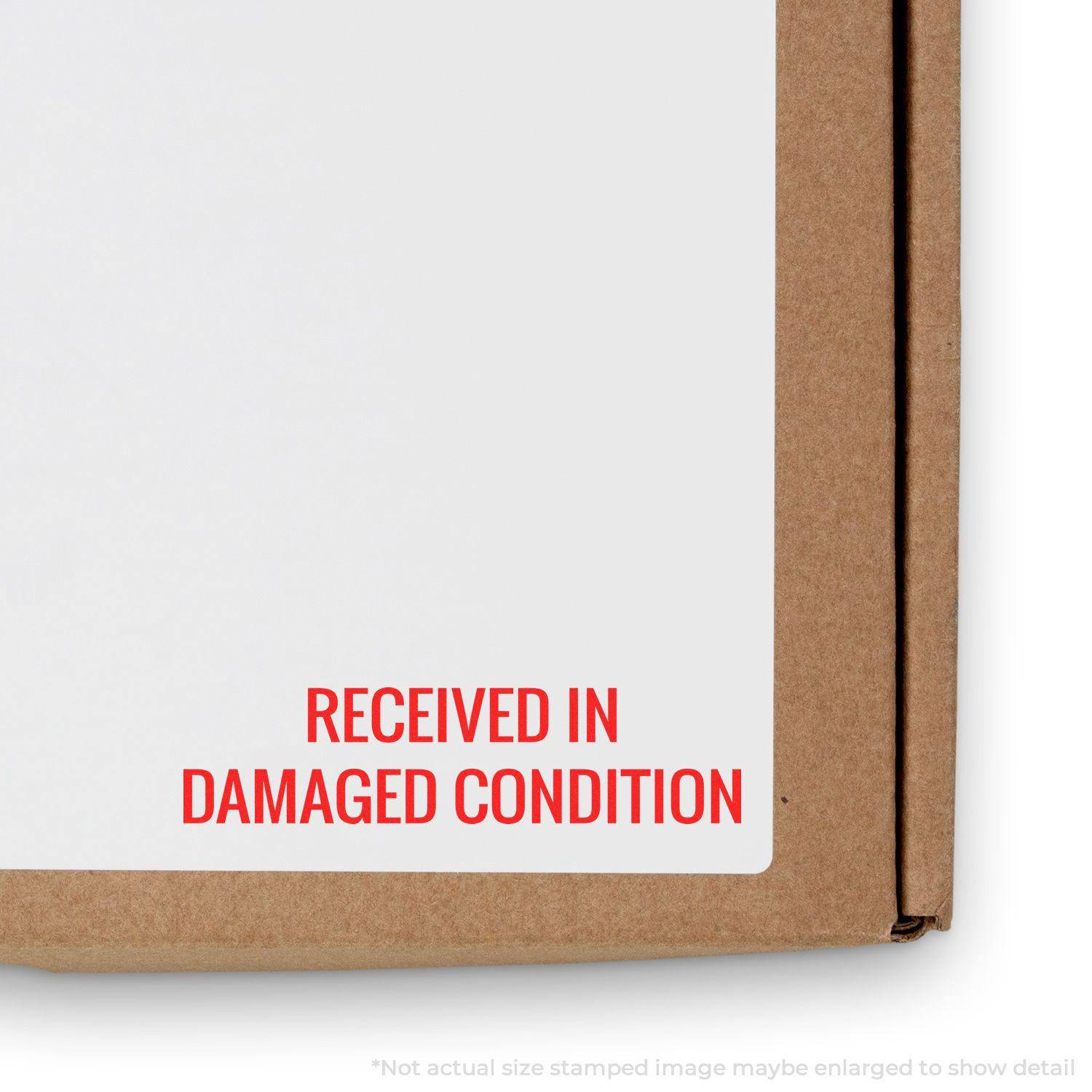 Large Pre-Inked Received in Damaged Condition Stamp used on a cardboard box, showing the red text RECEIVED IN DAMAGED CONDITION.