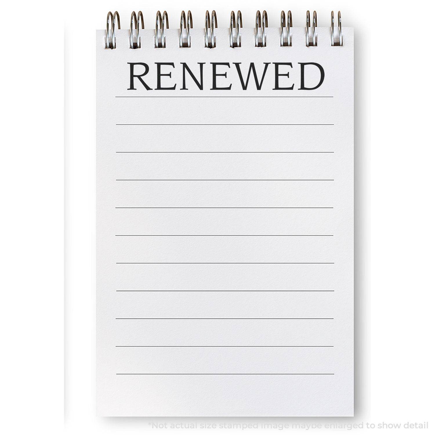 A Large Pre-Inked Renewed Stamp is used on a white notepad with lined pages, displaying the word RENEWED in bold black letters at the top.