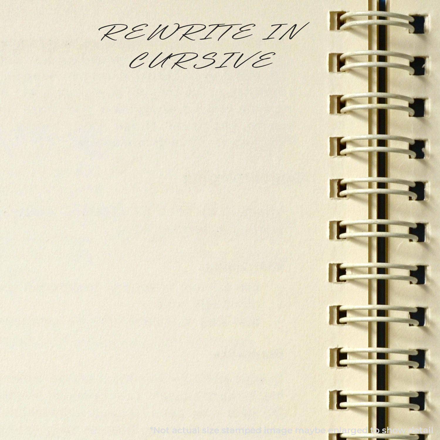 Notebook page with 'REWRITE IN CURSIVE' stamped at the top using the Large Rewrite In Cursive Rubber Stamp, next to a spiral binding.