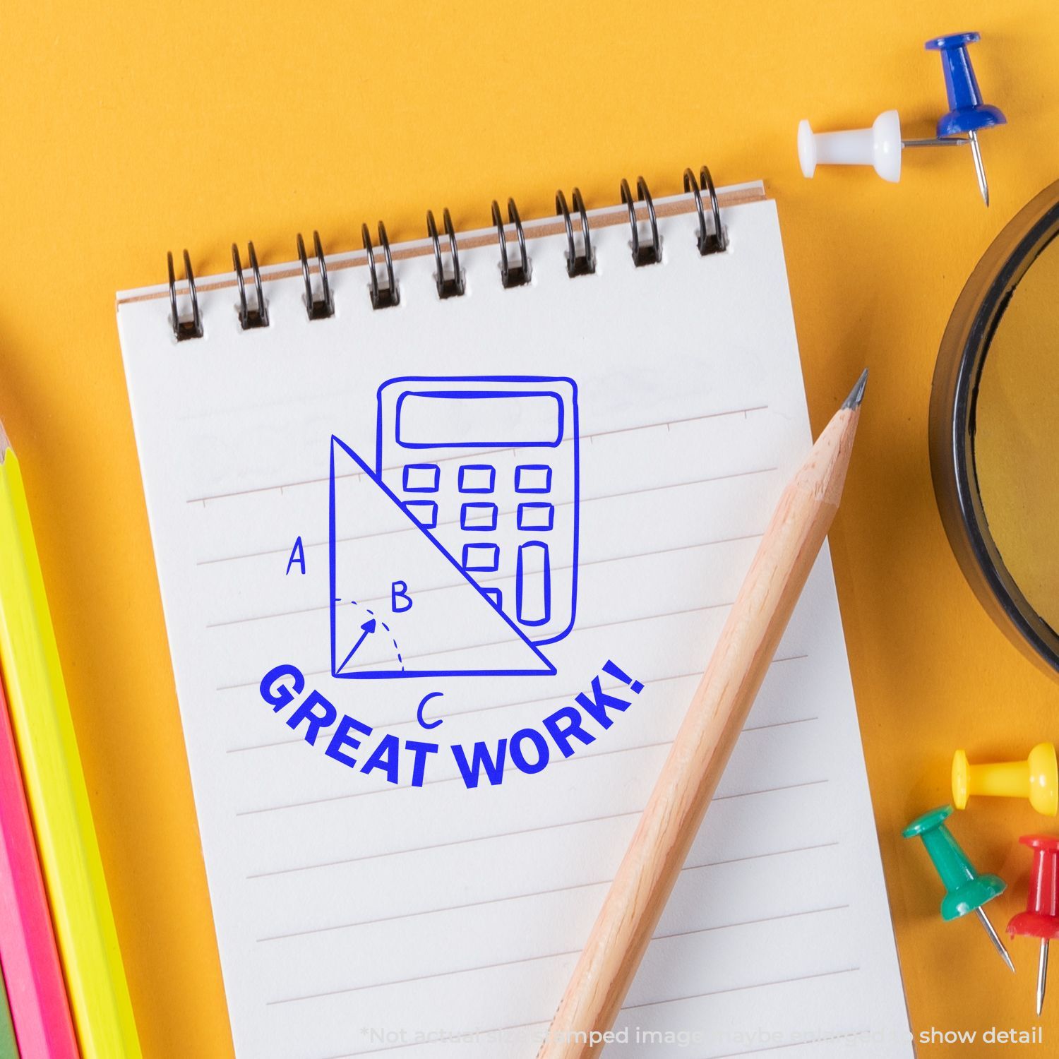 Self Inking Round Great Work with Calculator Stamp on a notepad with a pencil, colorful pins, and a magnifying glass on a yellow background.