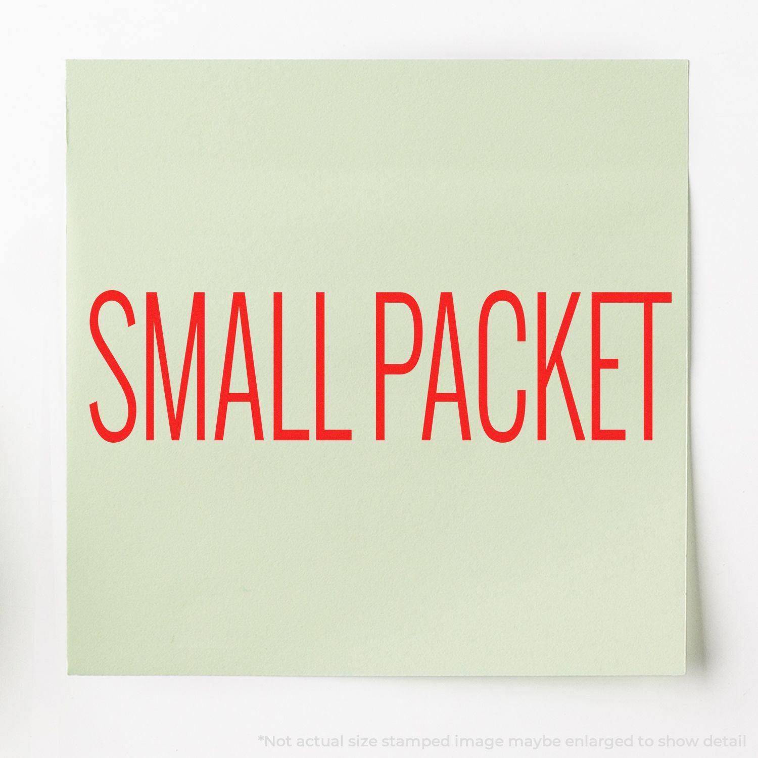 Large Pre-Inked Small Packet Stamp in use, displaying the text SMALL PACKET in bold red letters on a light green background.