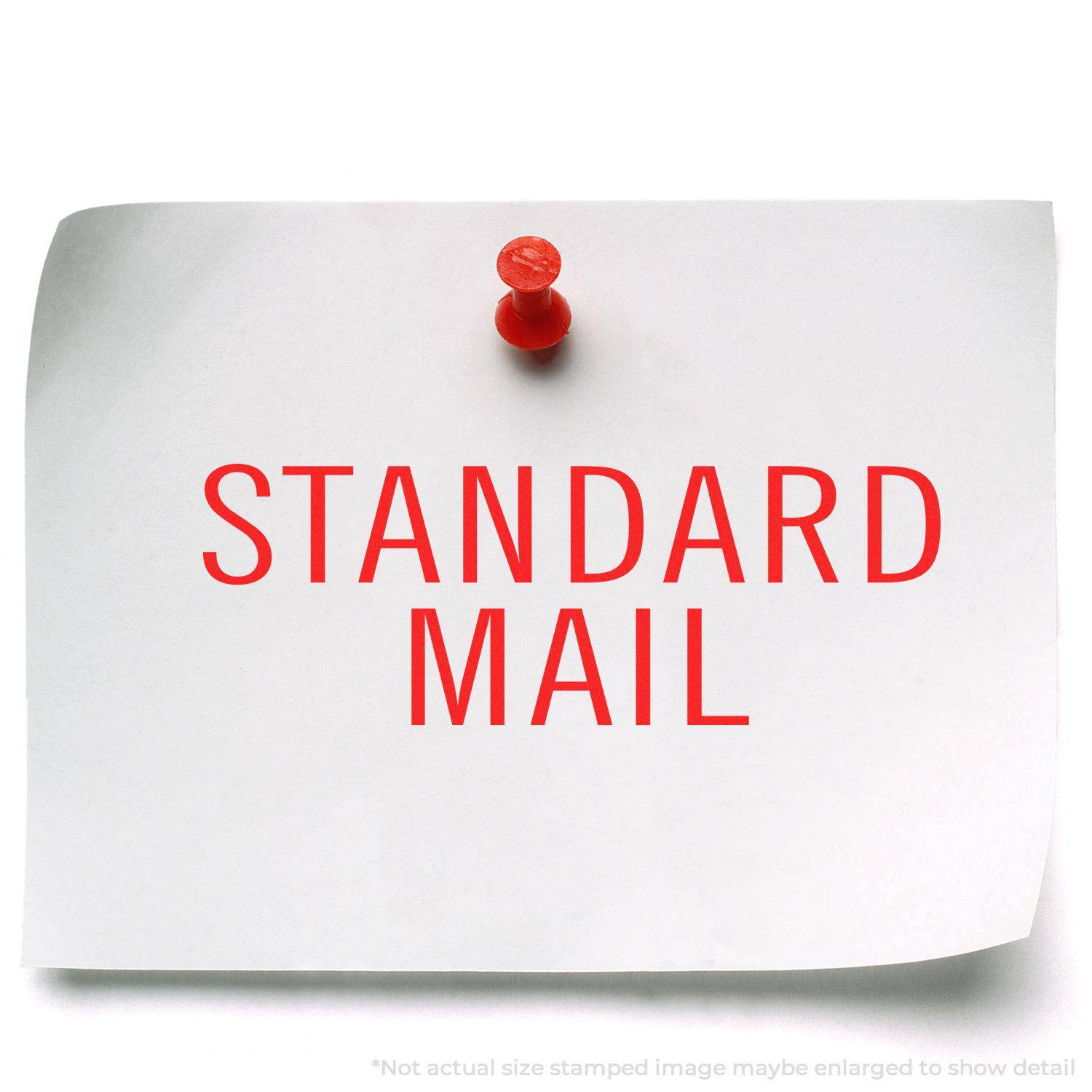 A white paper with STANDARD MAIL in red, pinned to a surface. Stamped using the Large Pre-Inked Standard Mail Stacked Stamp.