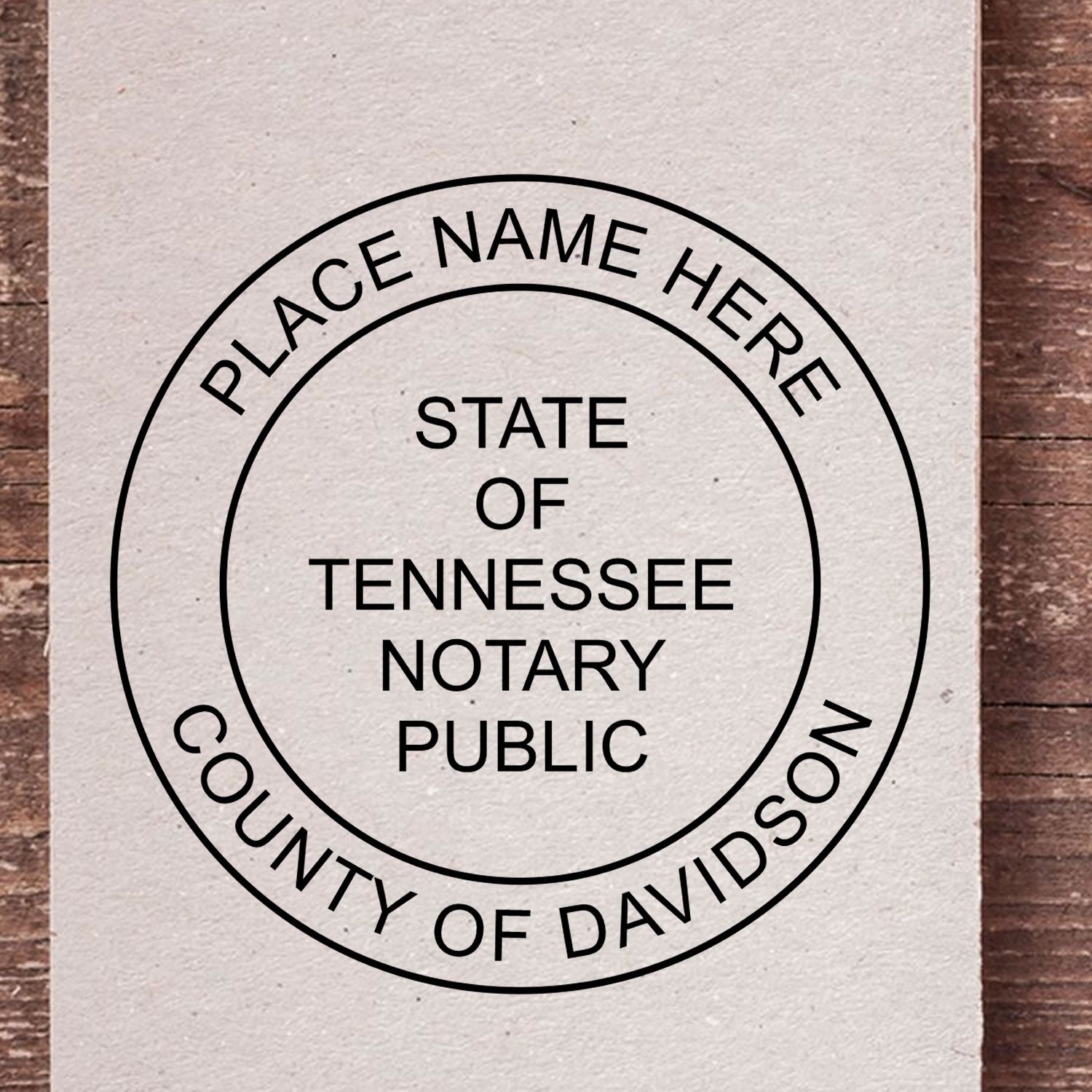 A lifestyle photo showing a stamped image of the Round Tennessee Notary Public Seal Stamp on a piece of paper