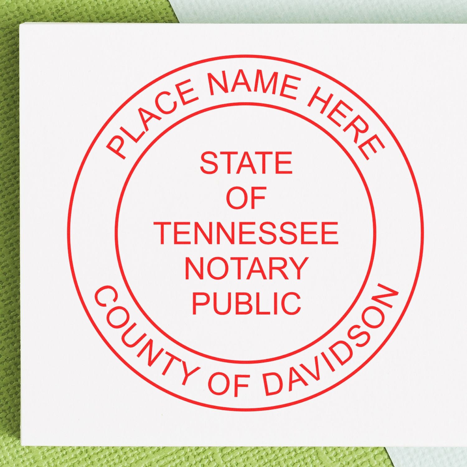 An alternative view of the Official Self-Inking Tennessee Notary Stamp stamped on a sheet of paper showing the image in use