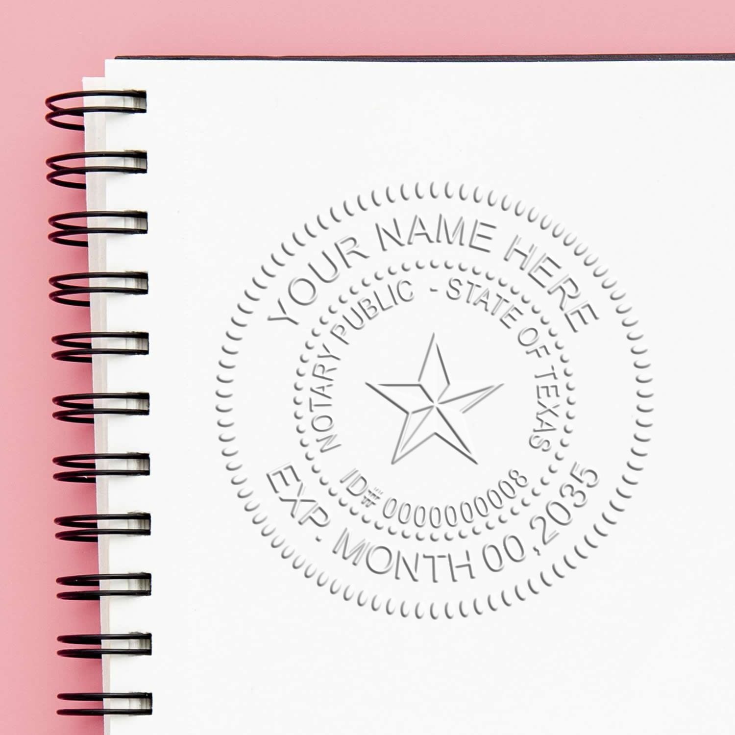 A stamped impression of the Texas Handheld Notary Seal Embosser in this stylish lifestyle photo, setting the tone for a unique and personalized product.