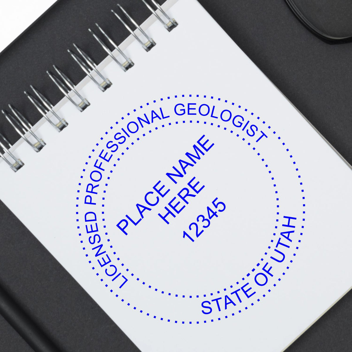 A stamped imprint of the Utah Professional Geologist Seal Stamp in this stylish lifestyle photo, setting the tone for a unique and personalized product.