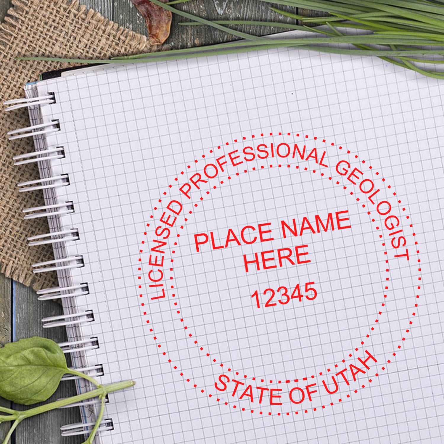 An in use photo of the Slim Pre-Inked Utah Professional Geologist Seal Stamp showing a sample imprint on a cardstock