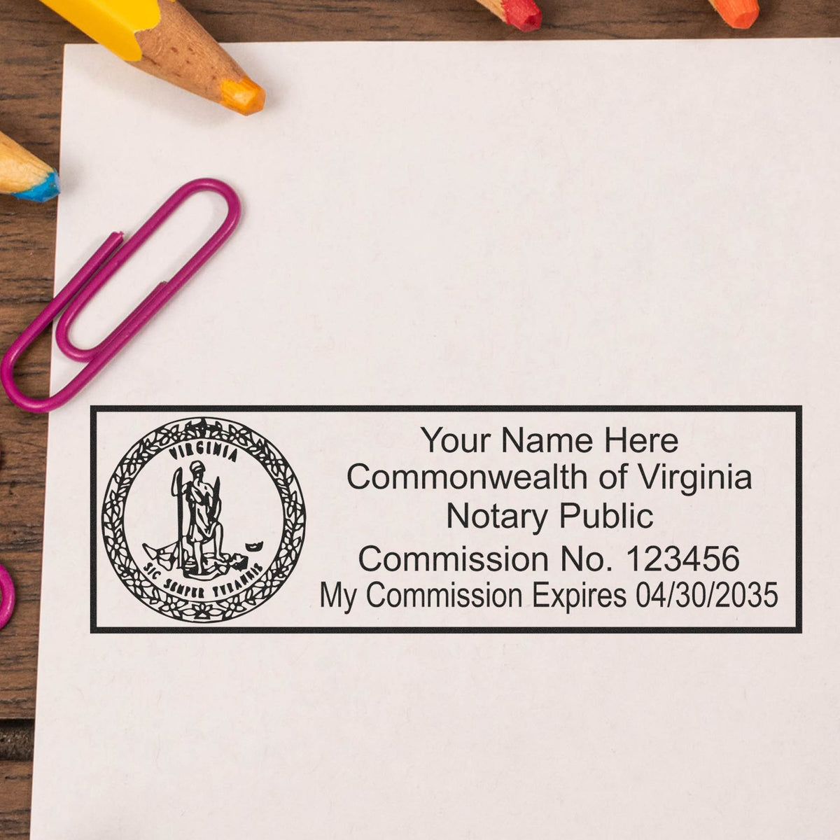 A lifestyle photo showing a stamped image of the Heavy-Duty Virginia Rectangular Notary Stamp on a piece of paper
