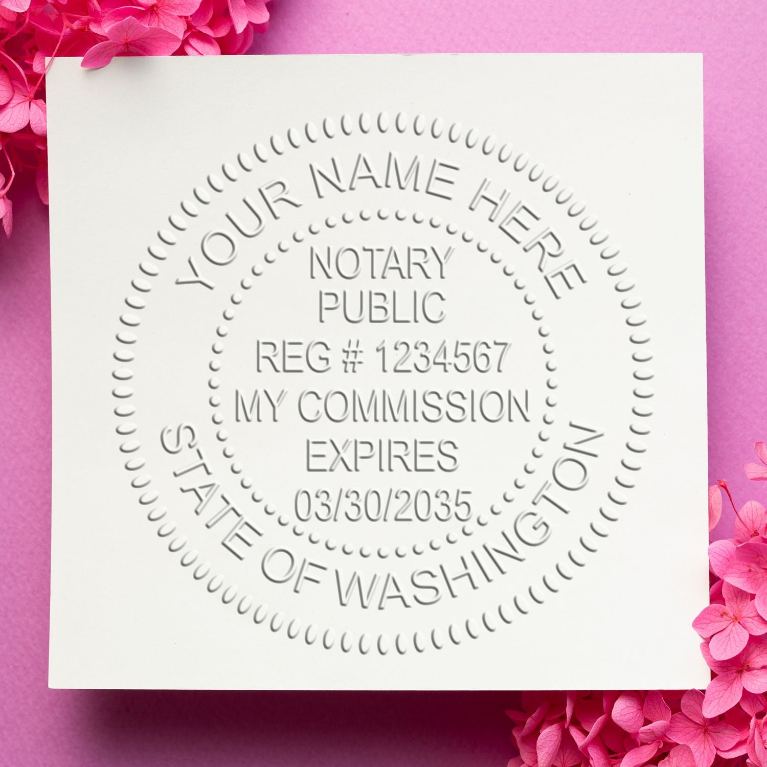 A lifestyle photo showing a stamped image of the Washington Handheld Notary Seal Embosser on a piece of paper
