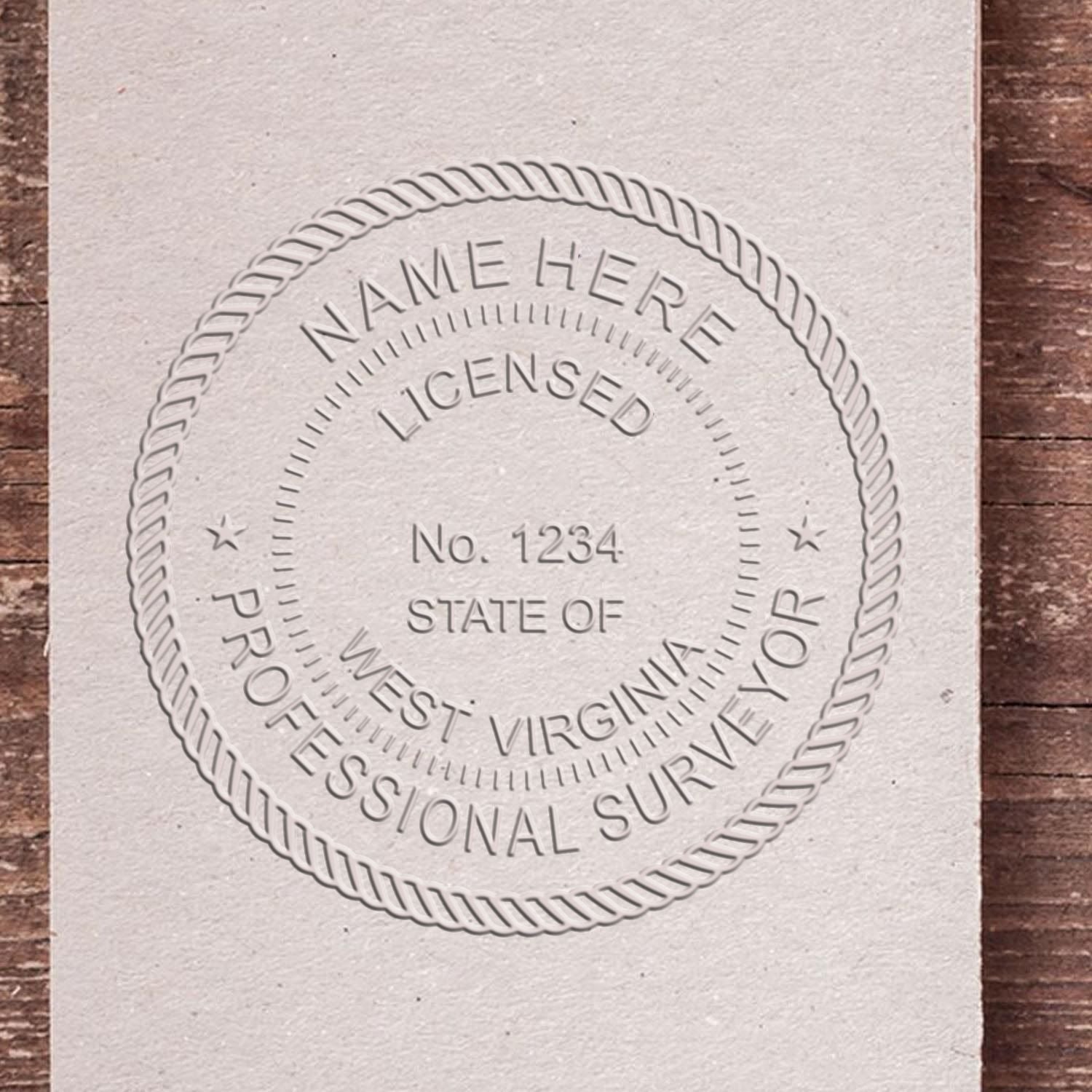 A lifestyle photo showing a stamped image of the Handheld West Virginia Land Surveyor Seal on a piece of paper