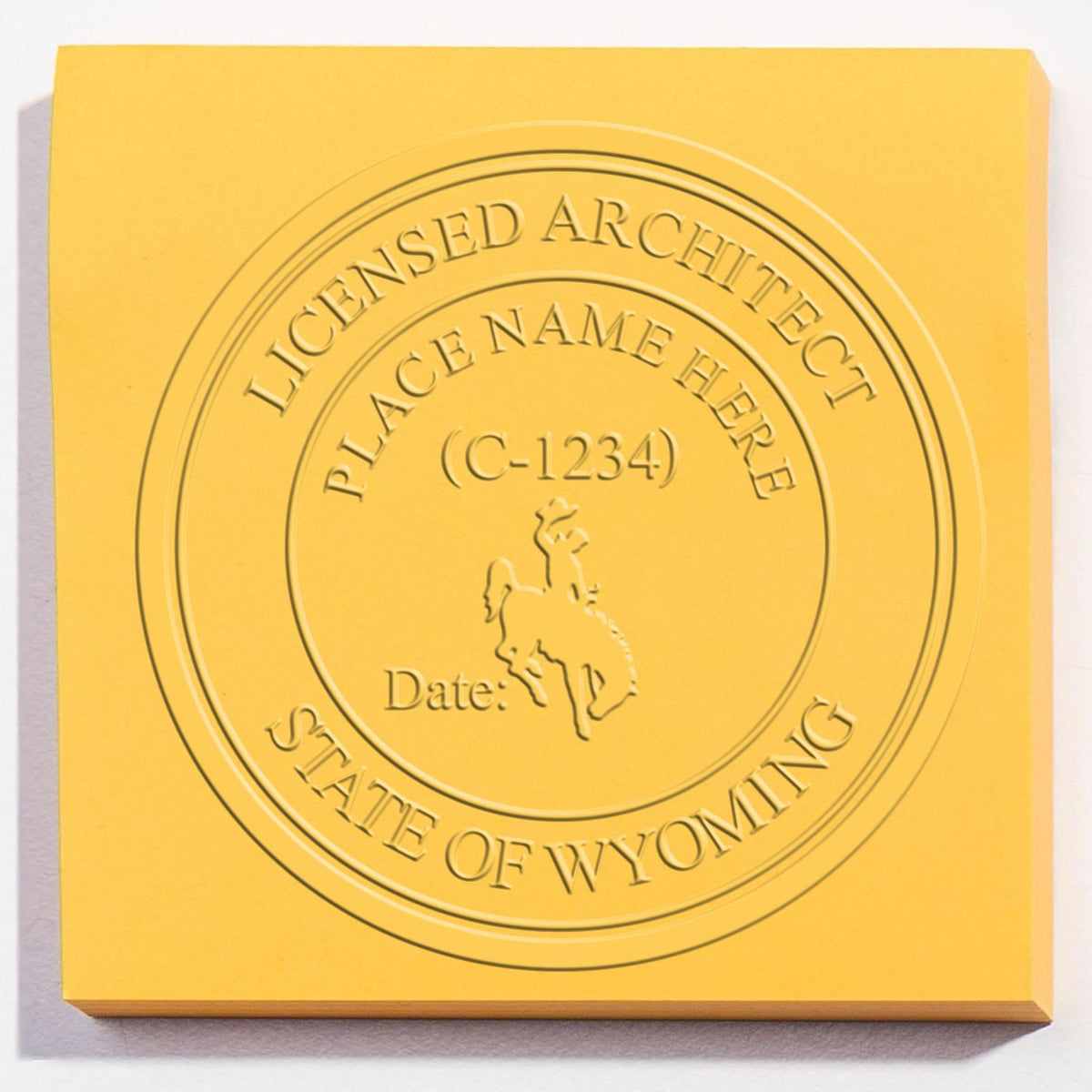 An in use photo of the Hybrid Wyoming Architect Seal showing a sample imprint on a cardstock