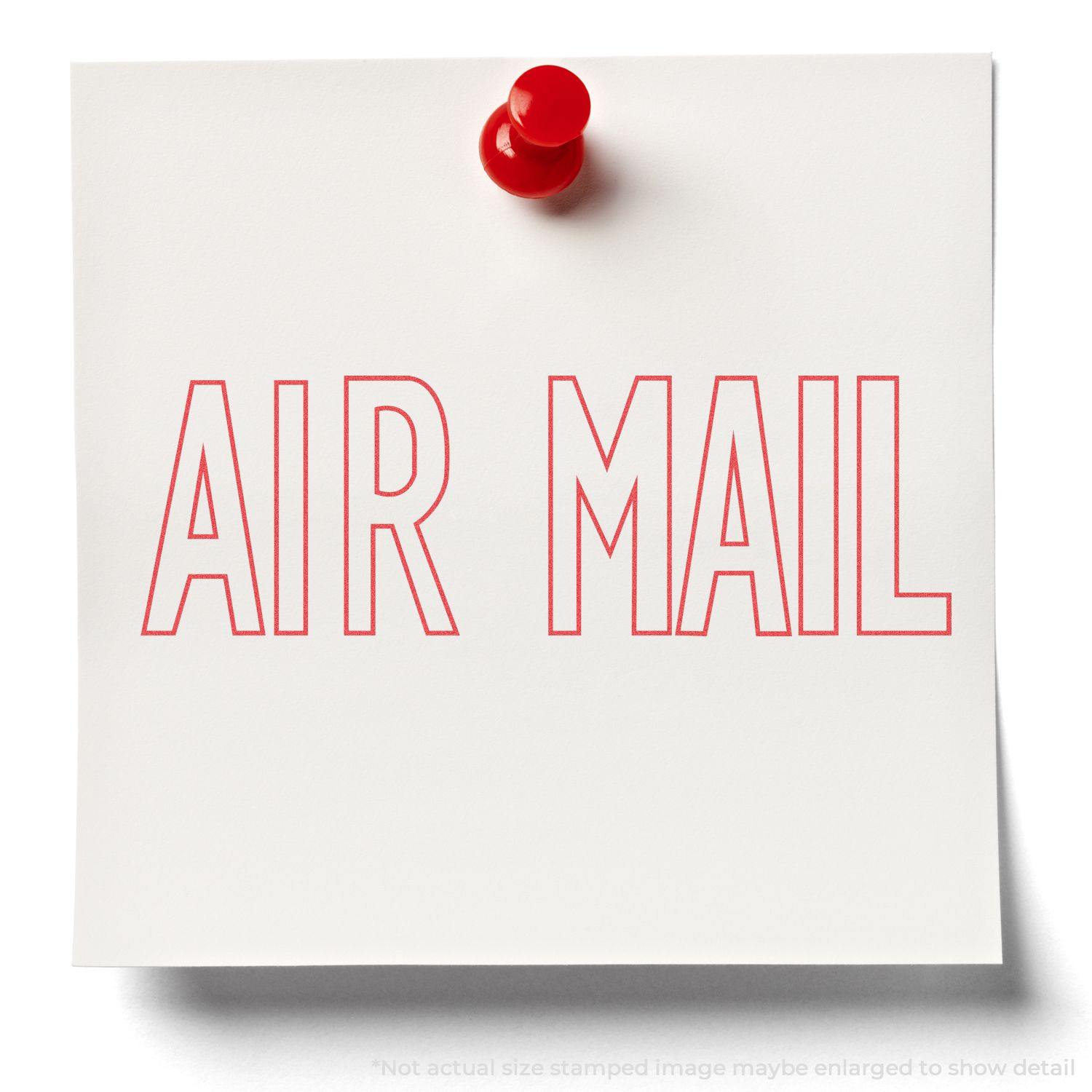A white note pinned with a red pushpin stamped with "AIR MAIL" in red ink using the Air Mail Xstamper Stamp.