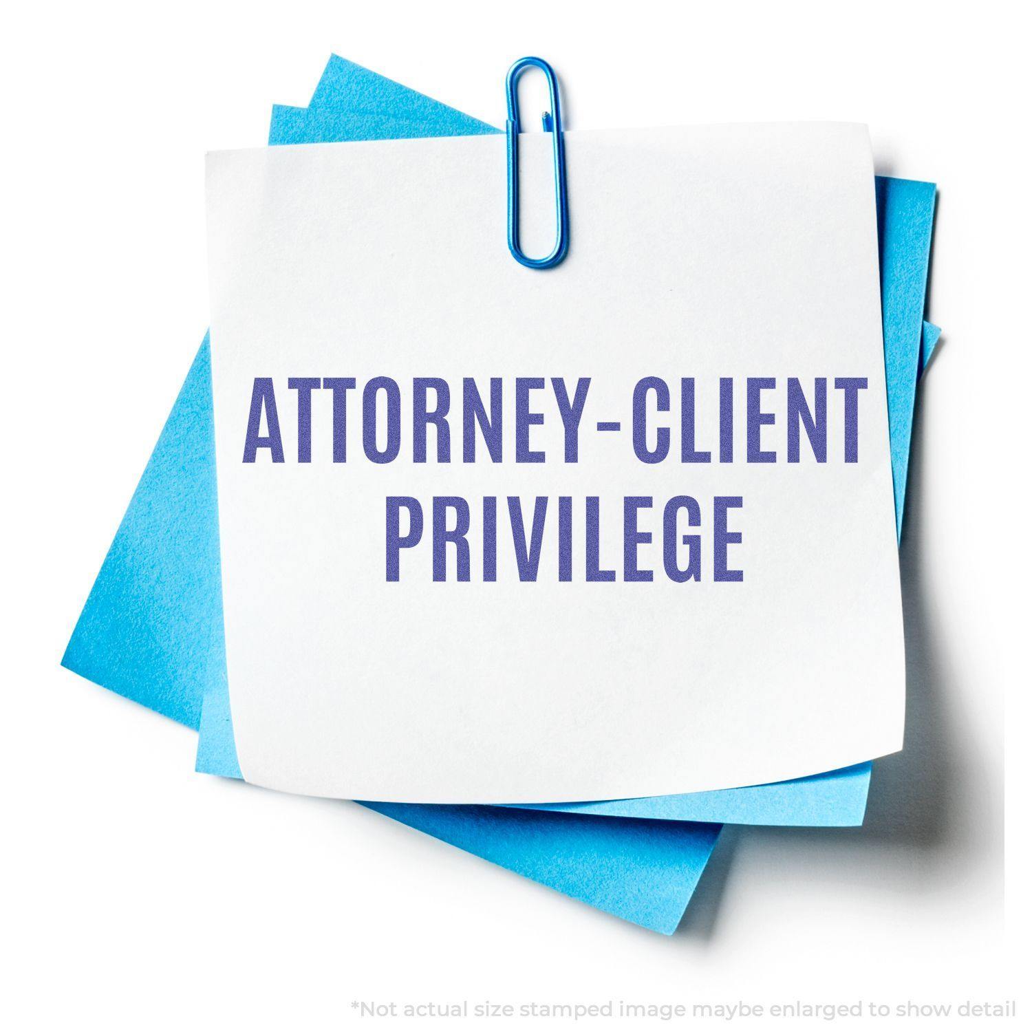 Blue paper with a white note stamped Attorney-Client Privilege using the Attorney-Client Privilege Xstamper Stamp, held by a blue paperclip.