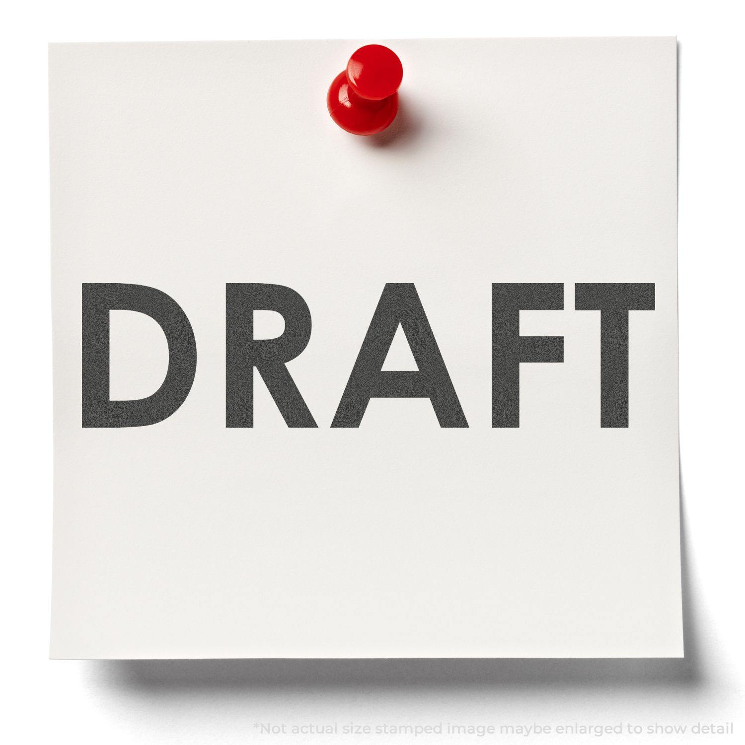 A white paper with DRAFT stamped in bold black letters using the Black Draft Xstamper Stamp, pinned with a red pushpin.