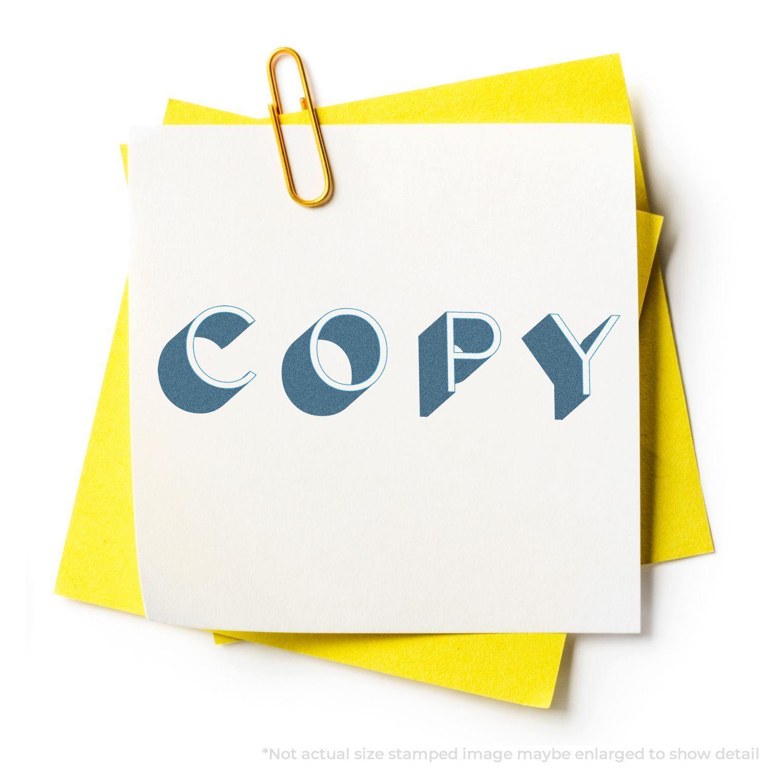 Bold Blue Copy Xstamper Stamp imprint on white paper, clipped with a yellow paper clip to yellow sheets.