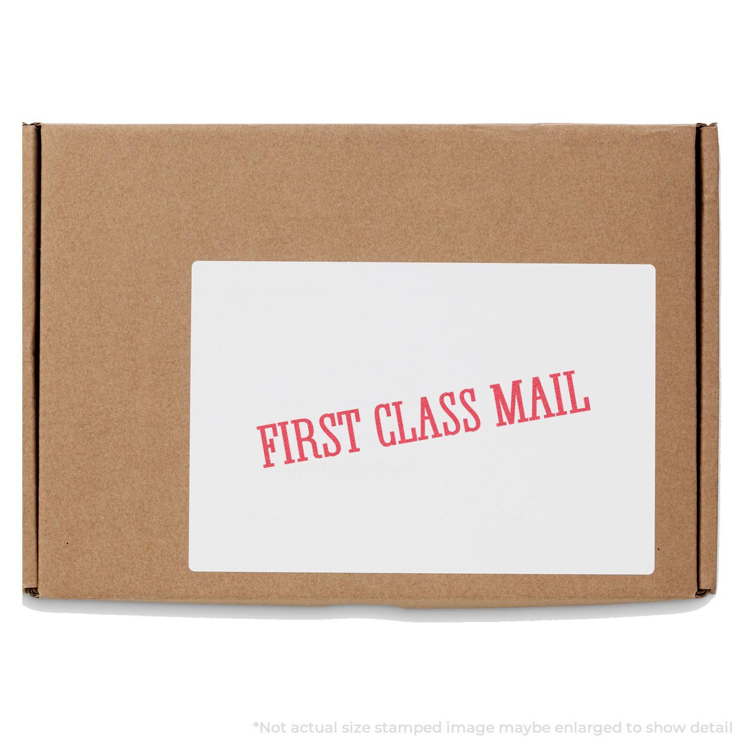 A cardboard box with a white label stamped FIRST CLASS MAIL in red using the Bold Red First Class Mail Xstamper Stamp.