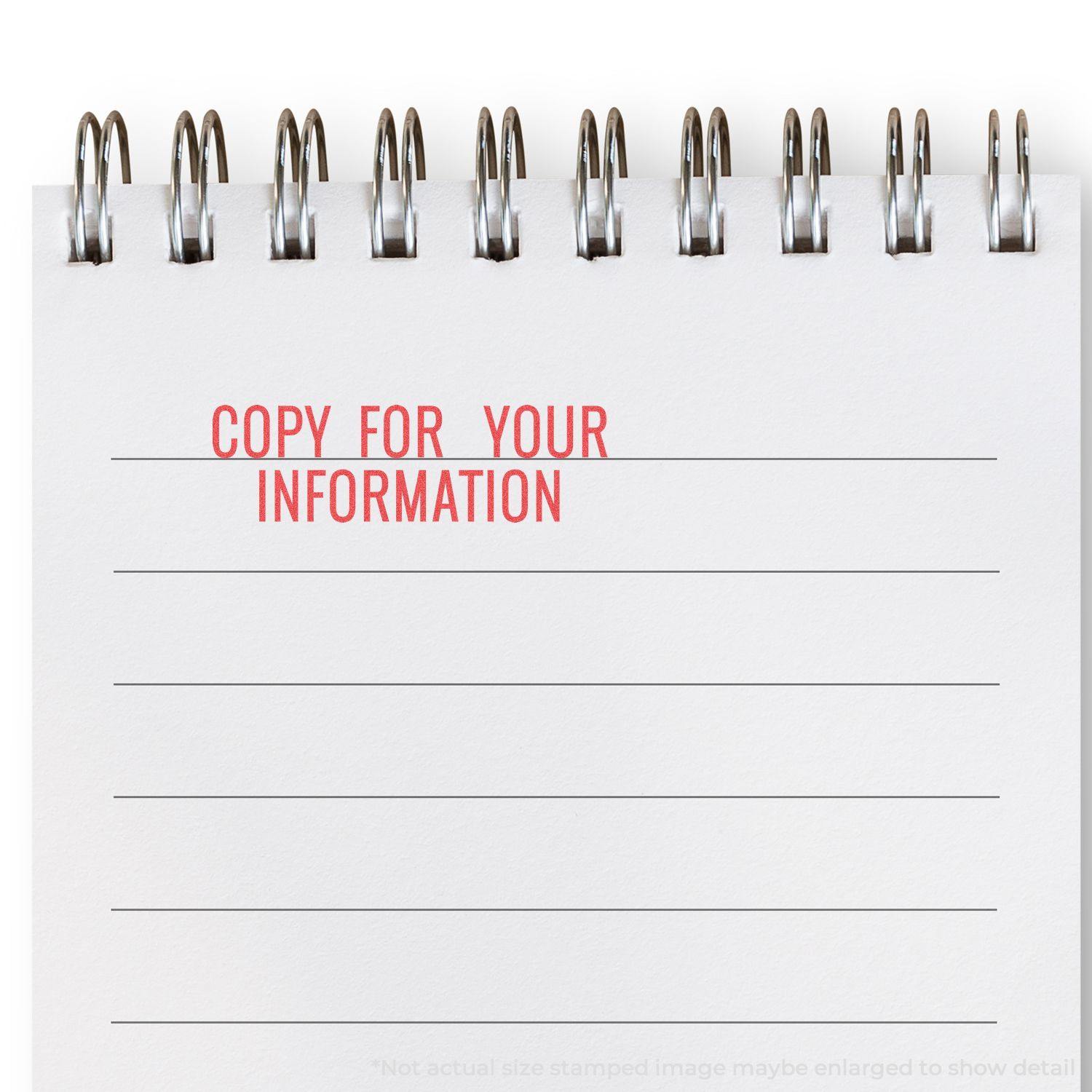 Copy For Your Information Xstamper Stamp impression in red ink on a white notepad with lined paper and a spiral binding.