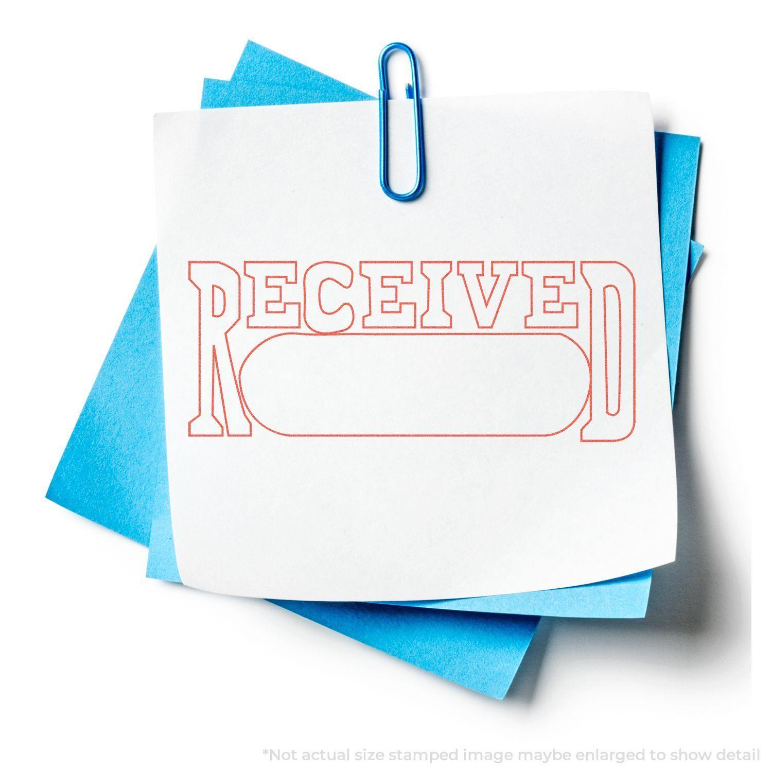 A Date Received Xstamper Stamp imprint in red ink on a white paper, clipped with blue paper clips to blue sheets.