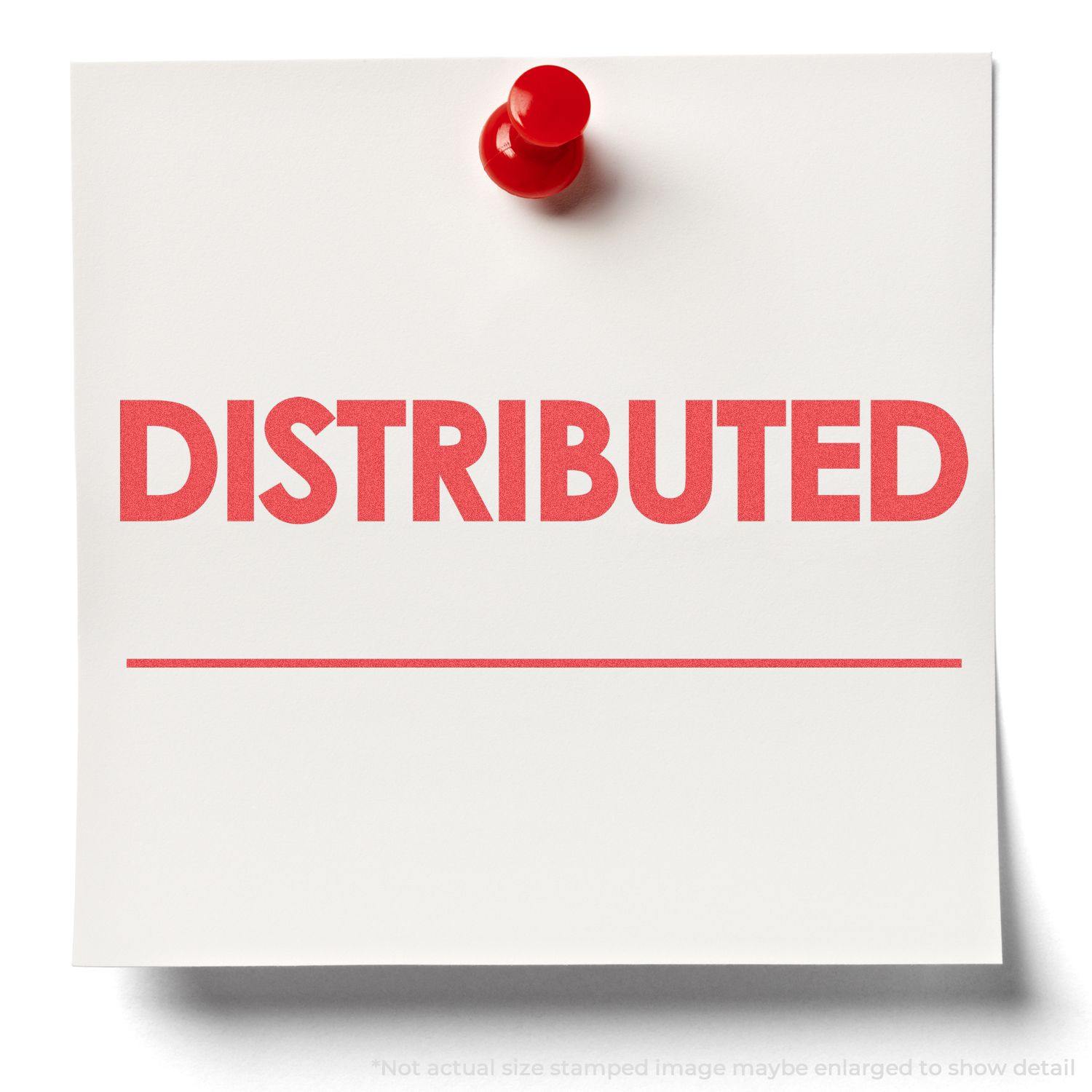A red pushpin holds a white note with the word "DISTRIBUTED" stamped in red using the Distributed Xstamper Stamp.