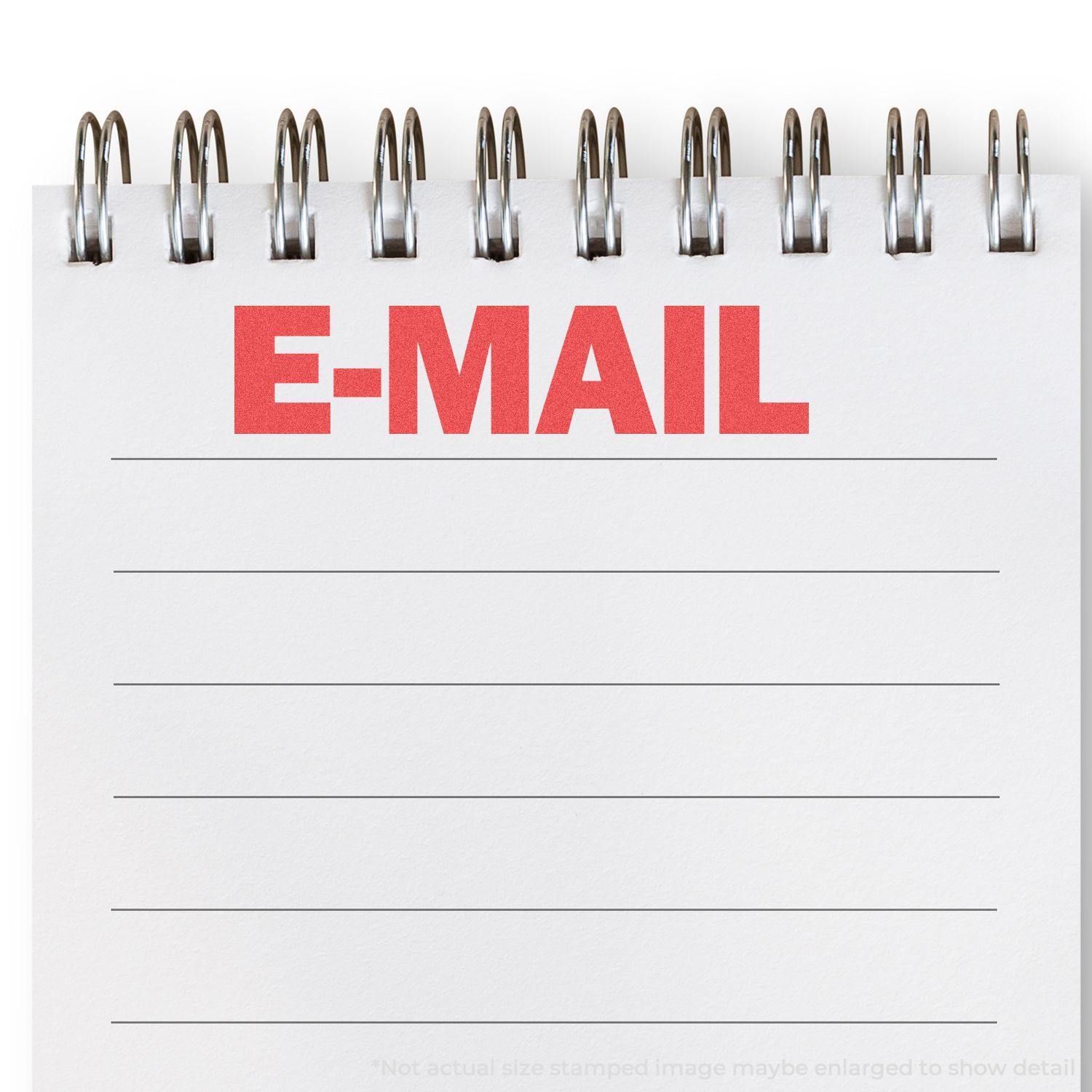 A notepad with E-MAIL stamped in red using the E-Mail Xstamper Stamp, featuring spiral binding and lined pages.