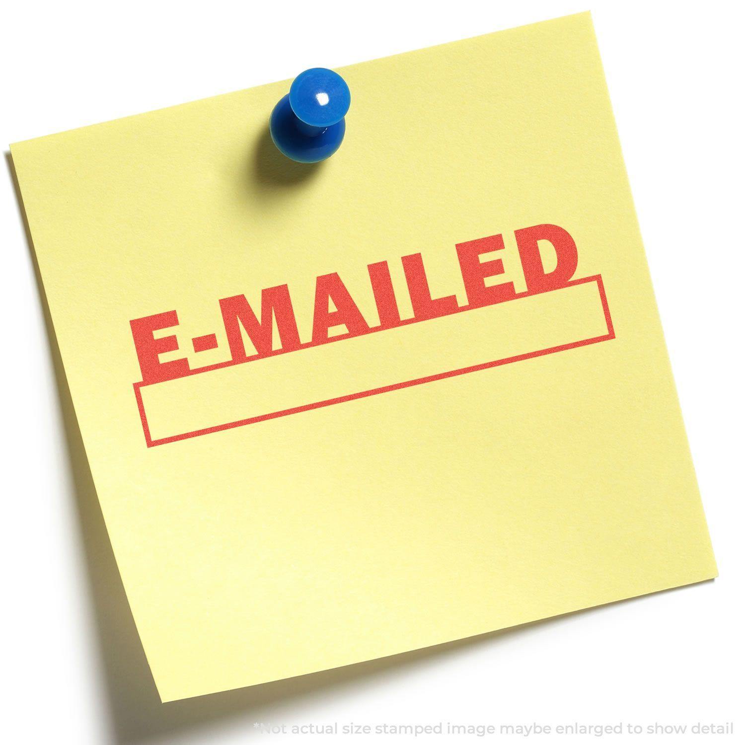Yellow sticky note with E-MAILED stamped in red using the E-Mailed Xstamper Stamp, pinned to a white surface with a blue pushpin.