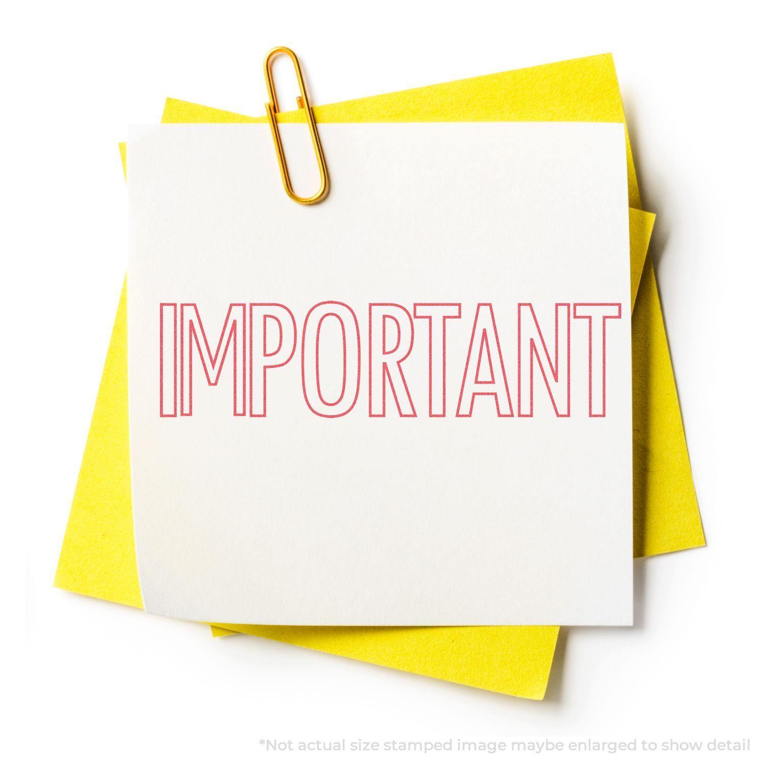 A yellow paper clip holds a white note stamped with IMPORTANT in red using the Important Xstamper Stamp, placed on yellow papers.