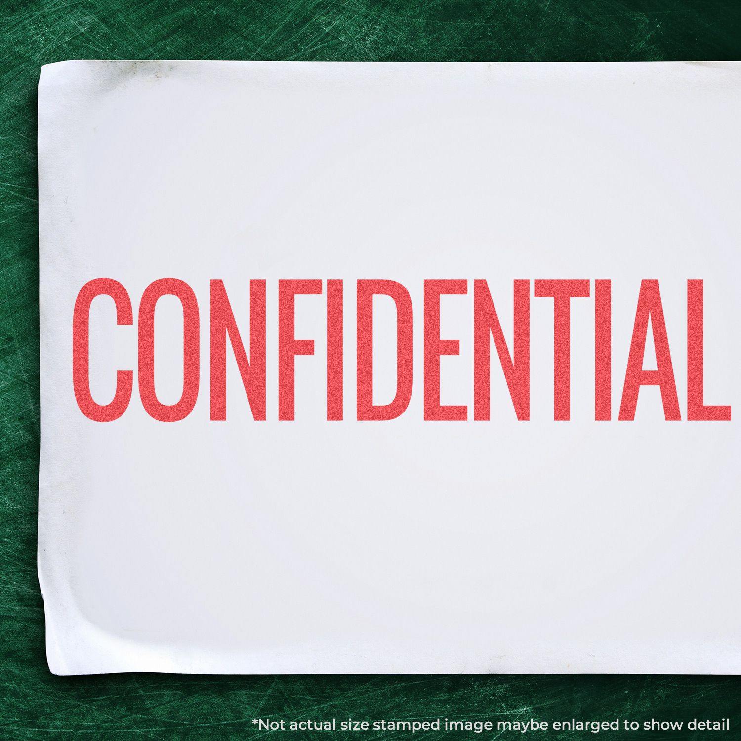 Jumbo Bold Red Confidential Xstamper Stamp imprint on white paper, displaying the word CONFIDENTIAL in large red letters against a green background.