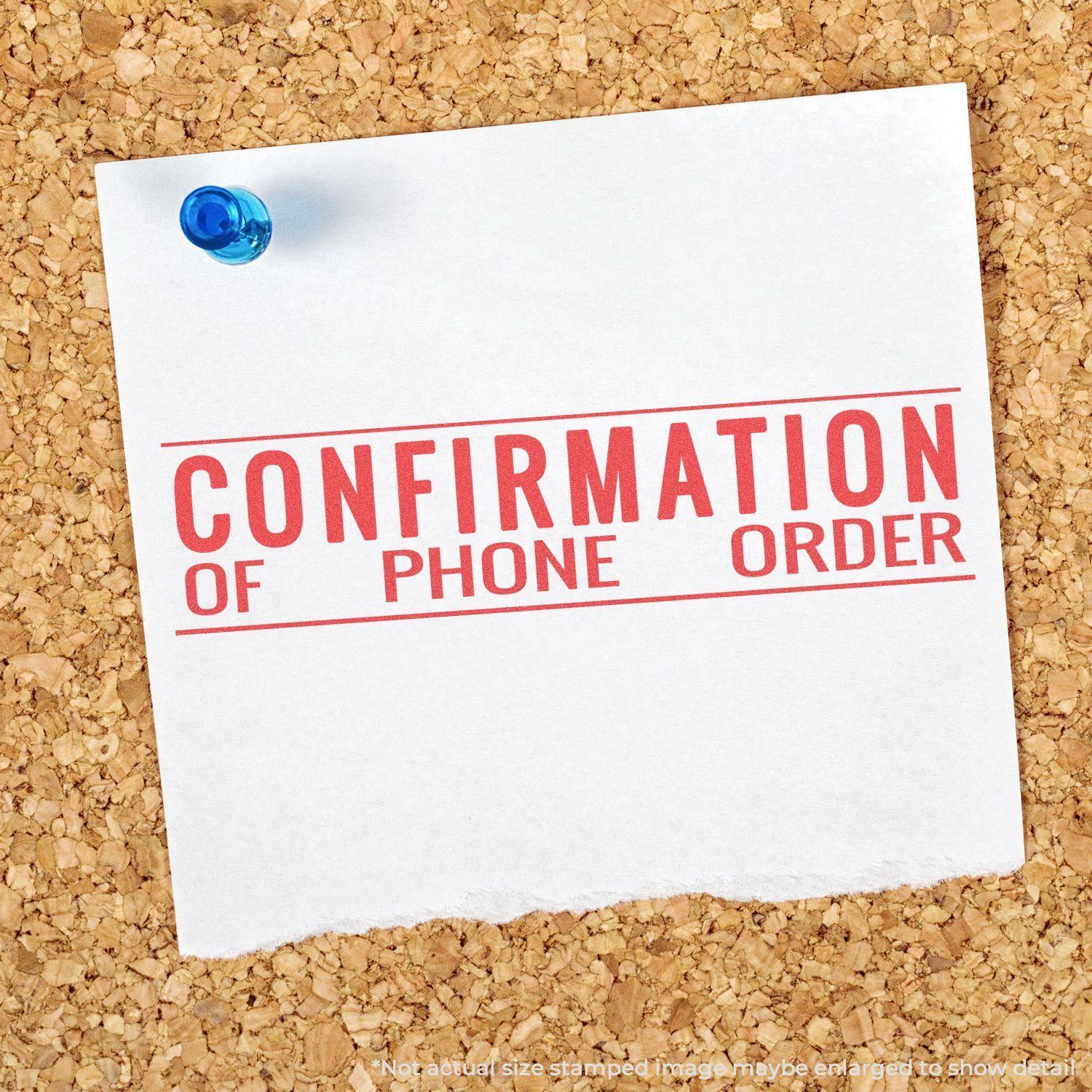 Jumbo Confirmation Of Phone Order Xstamper Stamp imprint on a white note pinned to a corkboard with a blue pushpin.