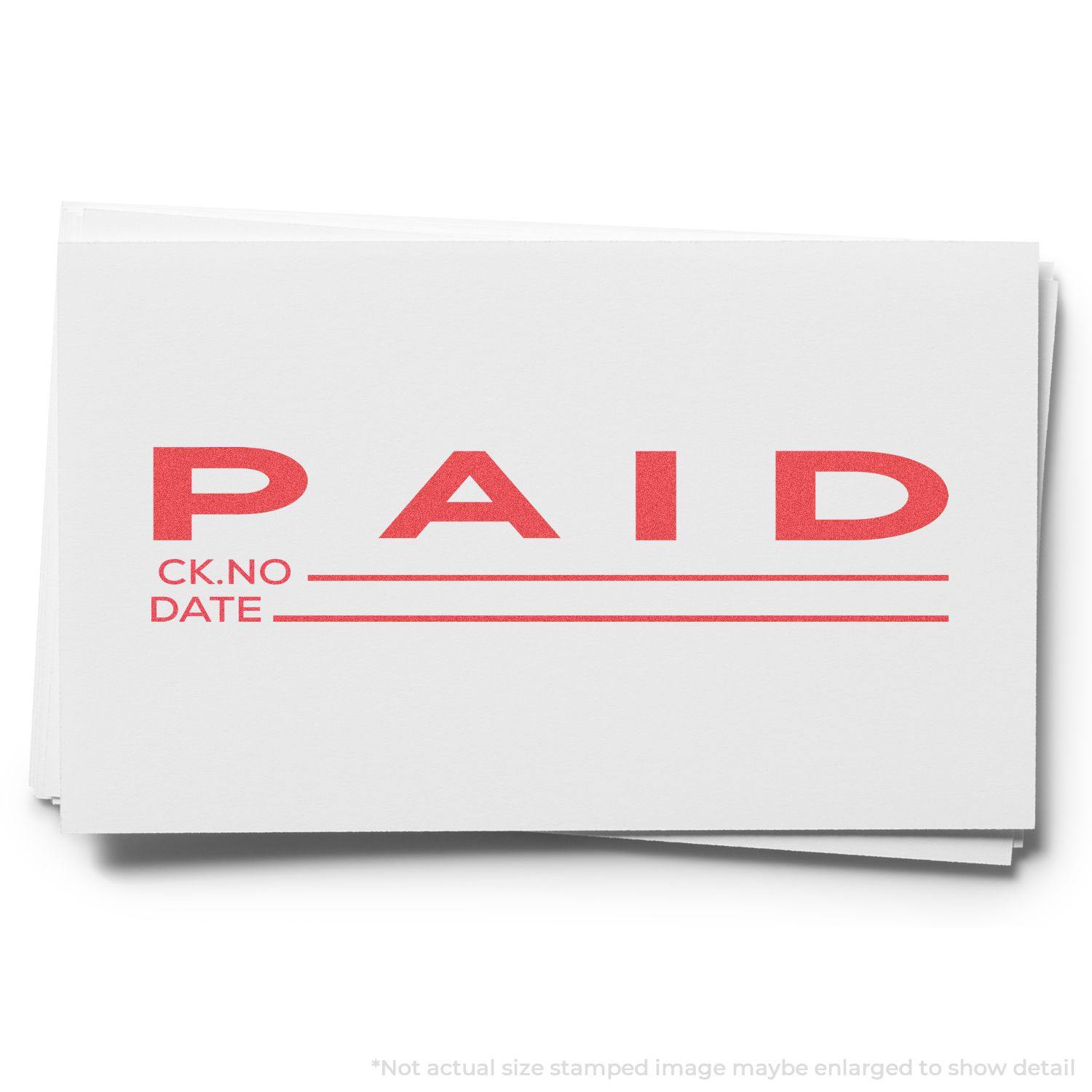 Image of a white card stamped with PAID in red ink using the Jumbo Paid Ck No.-Date Xstamper Stamp, with lines for check number and date.