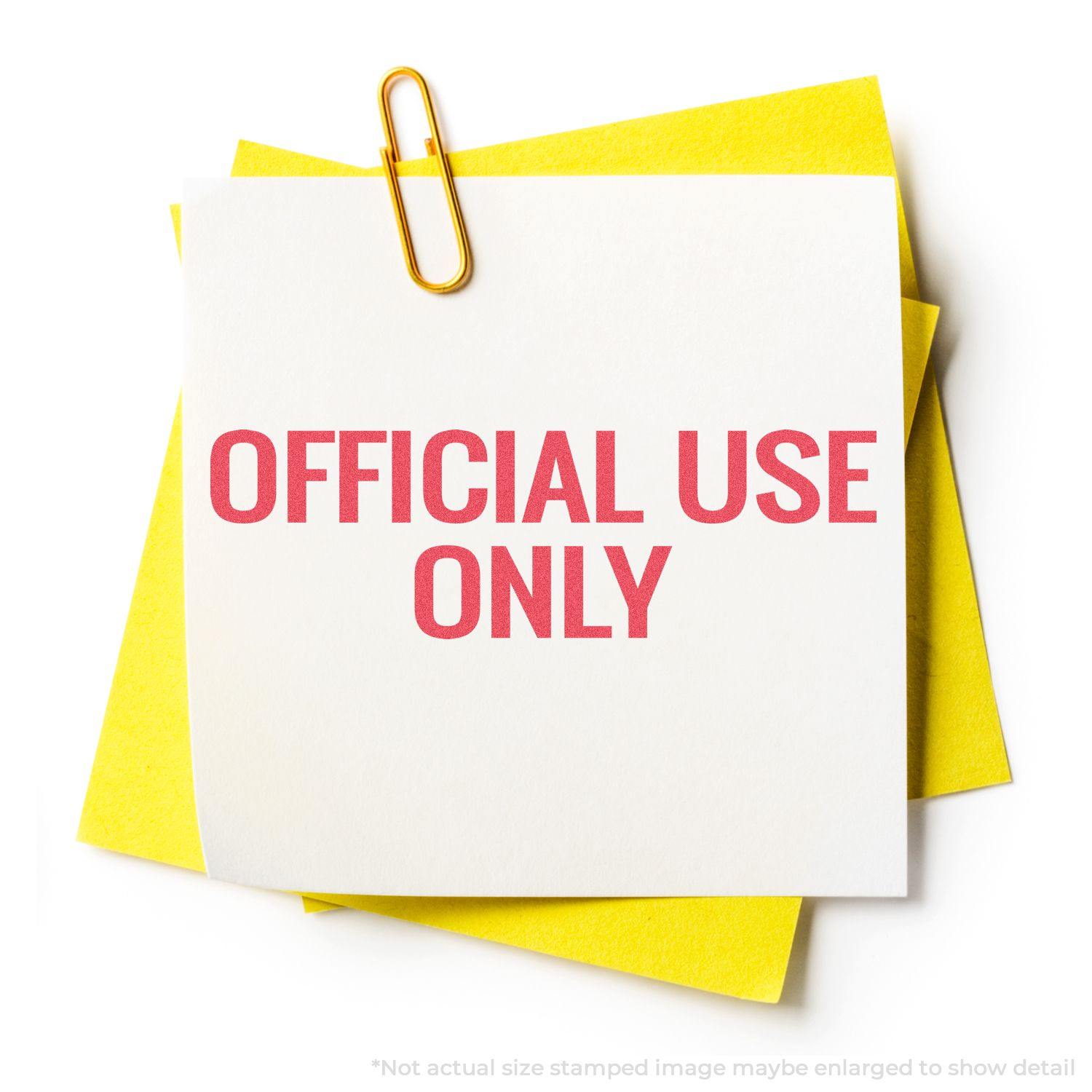 A yellow paper clip holds a white note stamped with OFFICIAL USE ONLY in red using the Official Use Only Xstamper Stamp.