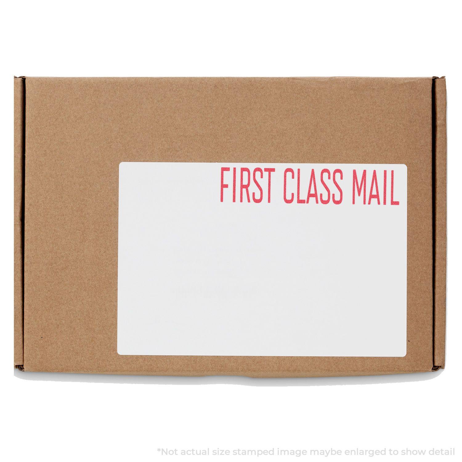 A brown package with a white label stamped FIRST CLASS MAIL in red using the Red First Class Mail Xstamper Stamp.