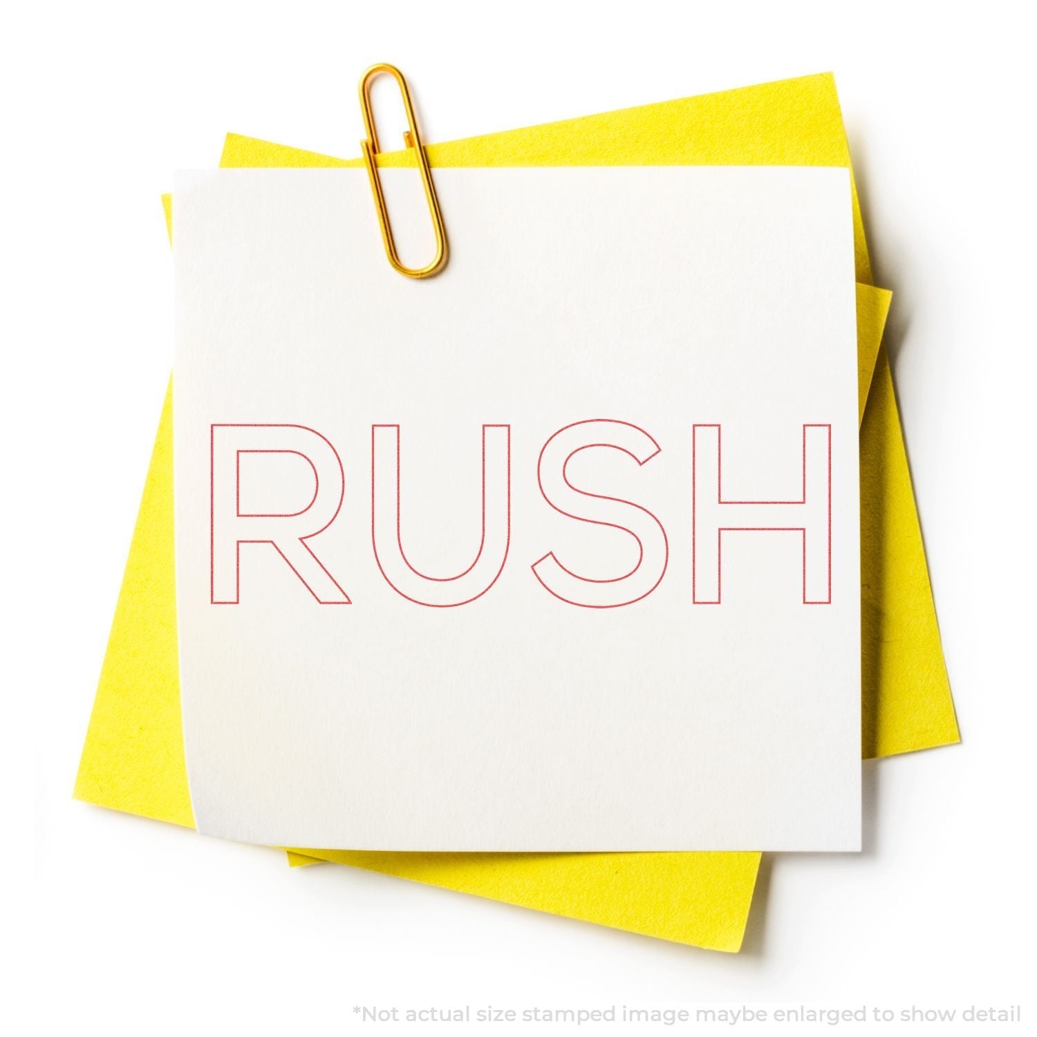 Custom Self Inking Stamp Trodat 4910 Size 3/8 x 1-3/32 used to stamp 'RUSH' on a white note with a yellow background and a paperclip.
