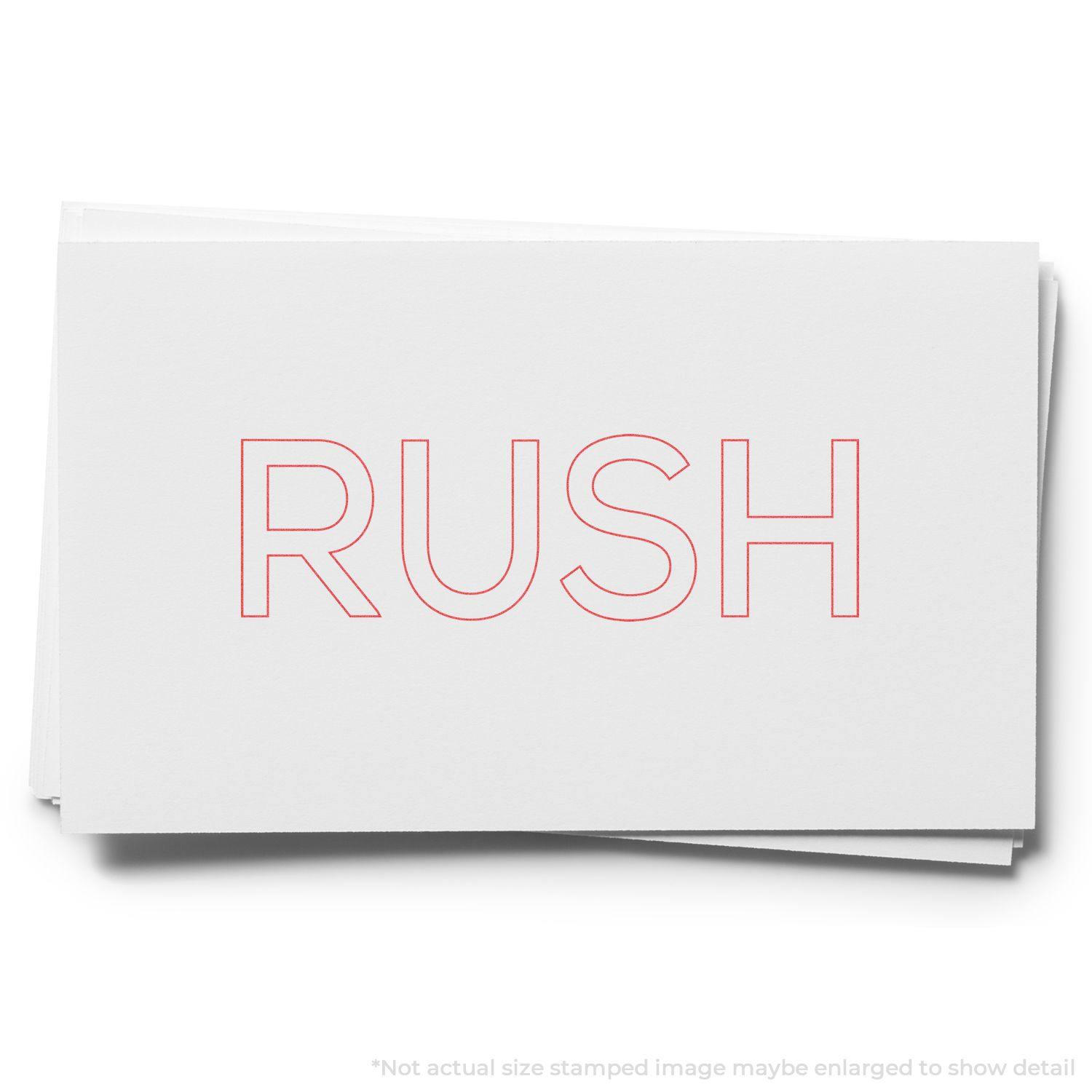Red Rush Xstamper Stamp imprinting the word RUSH in bold red letters on a white card.