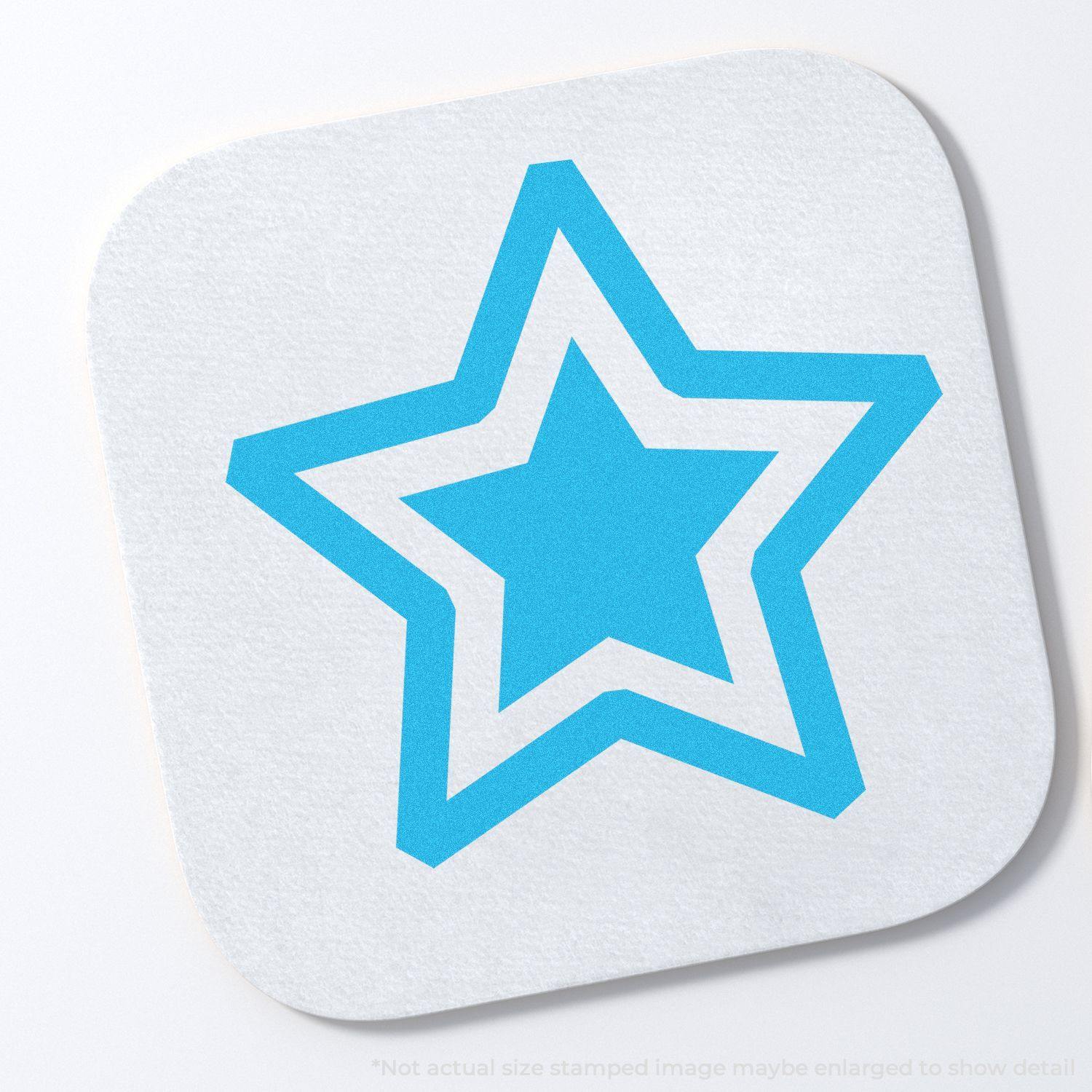 Round Blue Star Xstamper Stamp imprint showing a blue star with a white outline on a square white surface.