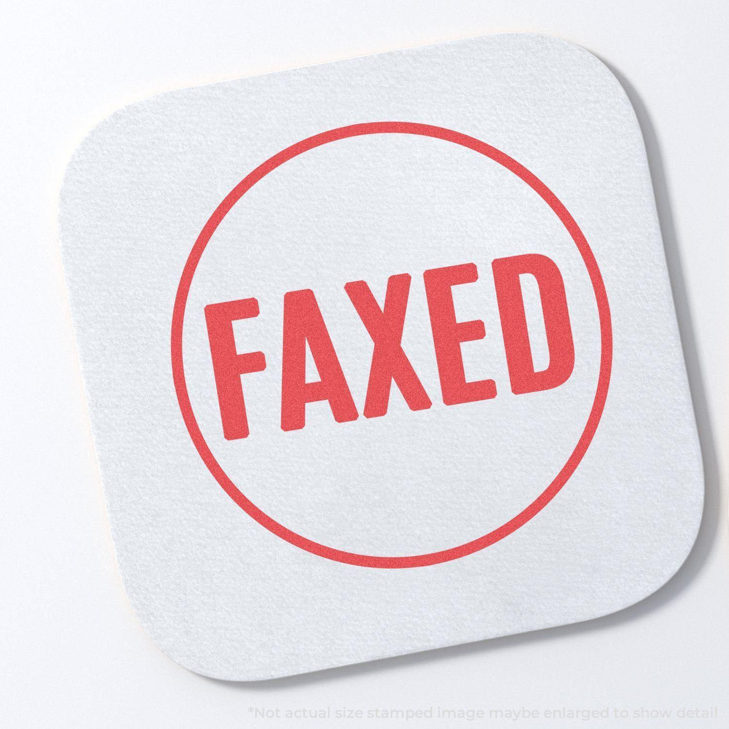 Round Faxed Xstamper Stamp imprint on white paper, displaying the word FAXED in bold red letters within a circular border.