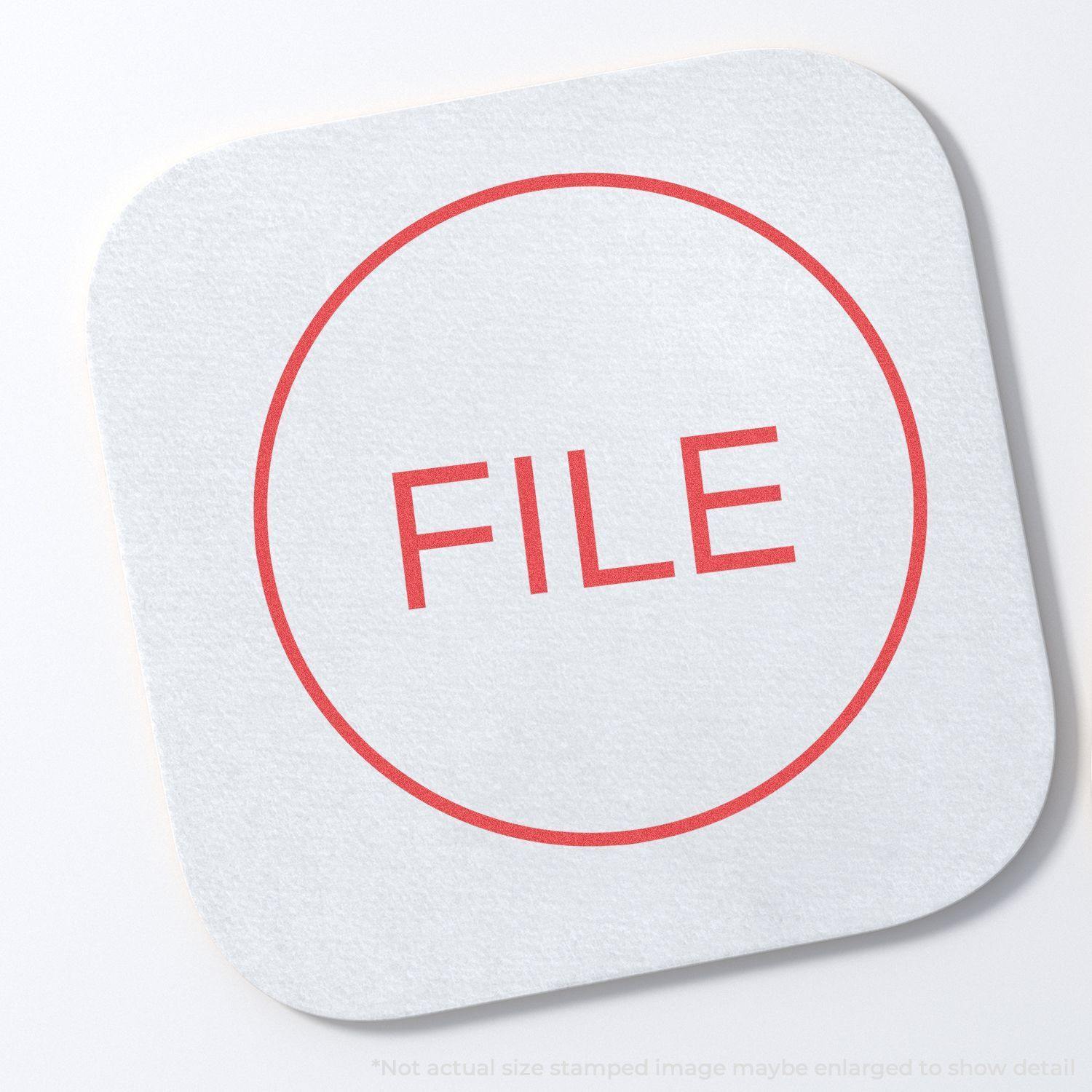 Round File Xstamper Stamp with a red circular border and the word FILE in the center, displayed on a white background.